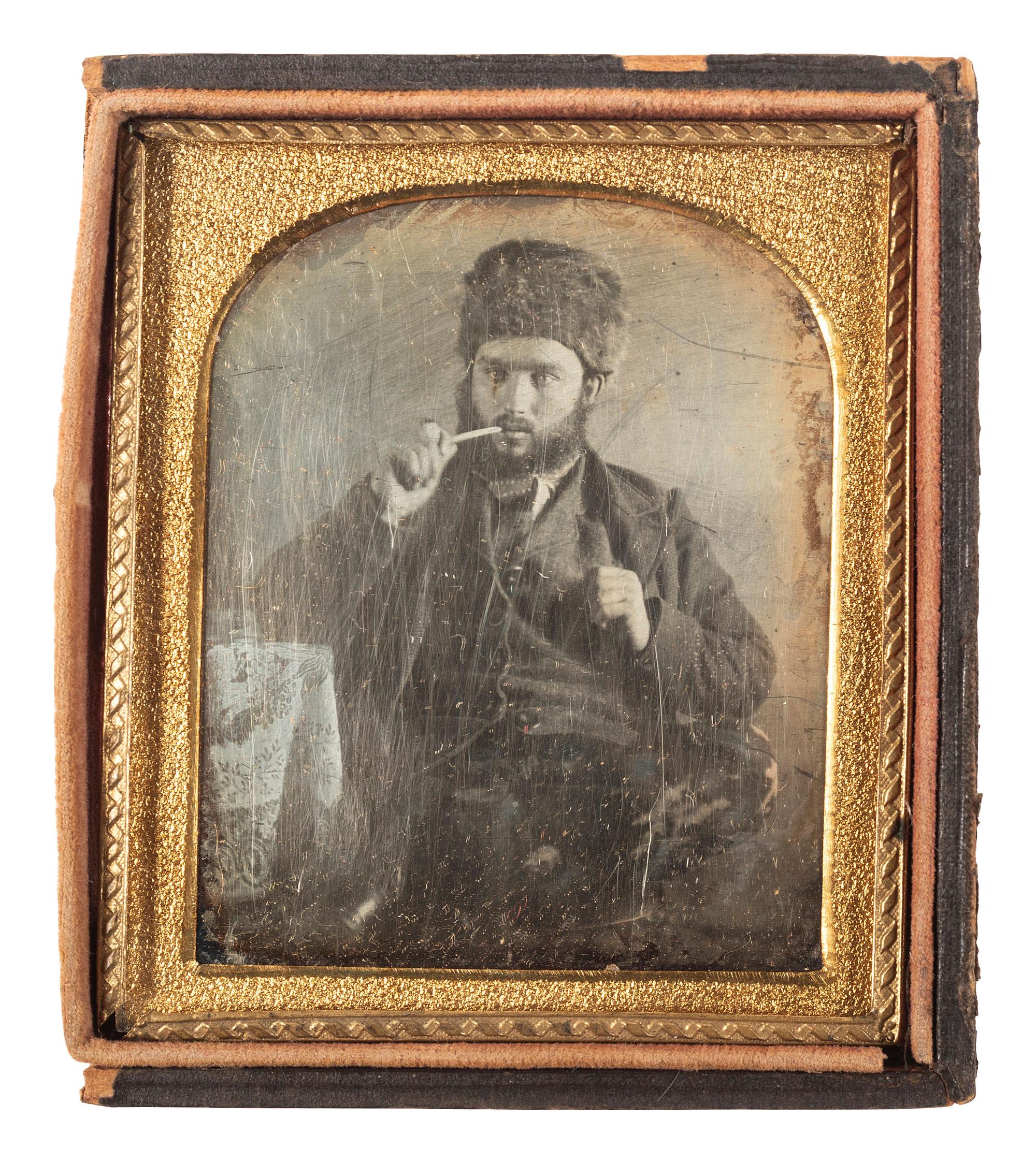 [EARLY PHOTOGRAPHY]. Sixth plate daguerreotype of man wearing a fur hat.
