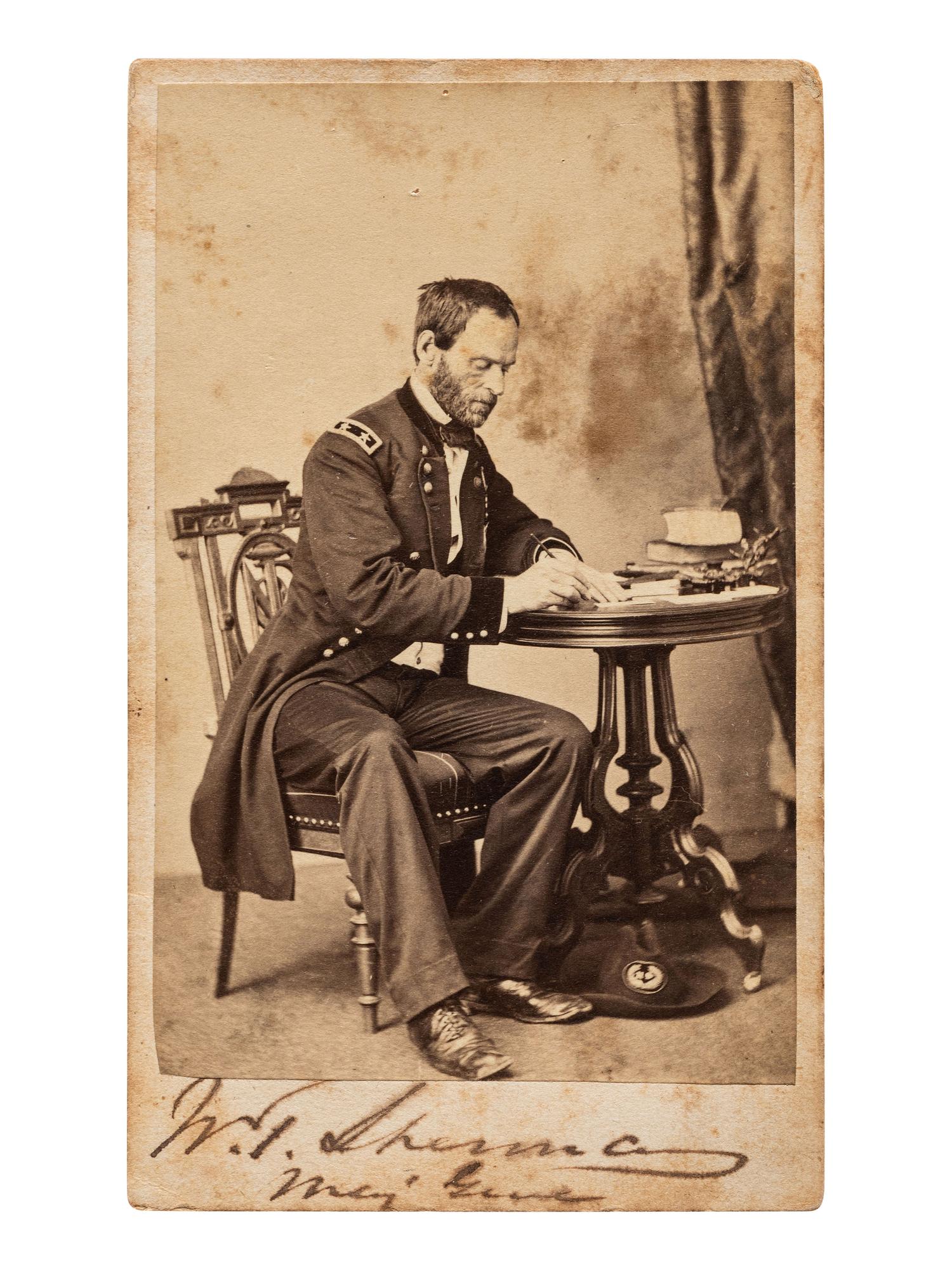 [SHERMAN, William Tecumseh (1820-1891)]. Signed CDV of Sherman as major general, seated at a desk. Chicago: S.M. Fassett, n.d.
