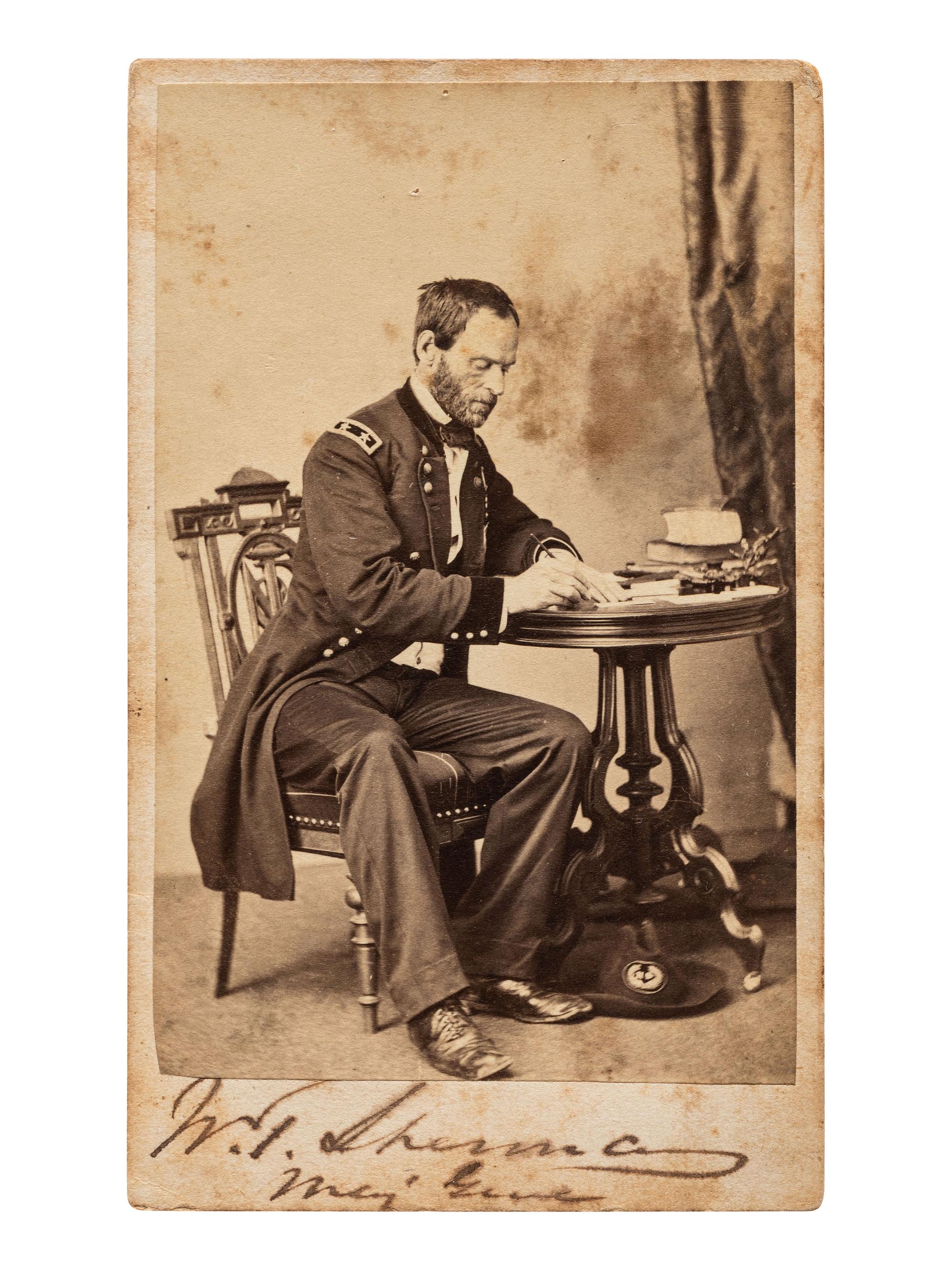[SHERMAN, William Tecumseh (1820-1891)]. Signed CDV of Sherman as major general, seated at a desk. Chicago: S.M. Fassett, n.d.
