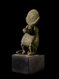 An Egyptian Bronze Baboon with a Sun Disc