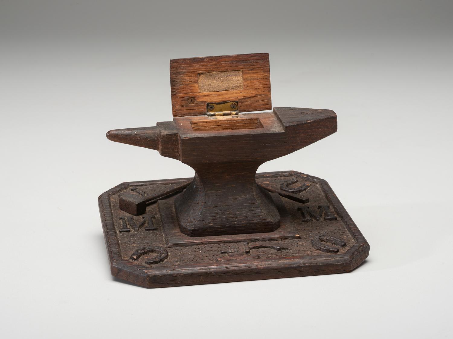 A Folk Art Carved and Stained Wood Anvil and Hammer Form Box