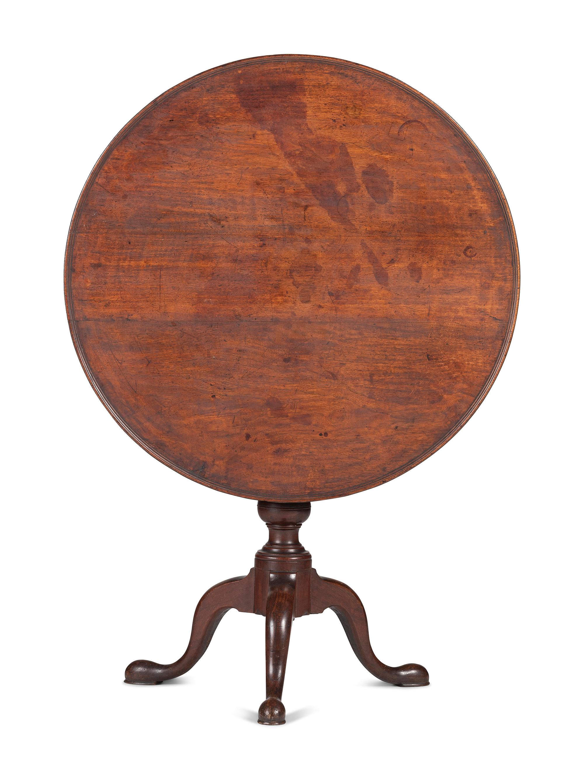A Chippendale Carved and Figured Mahogany Tilt-Top Tea Table