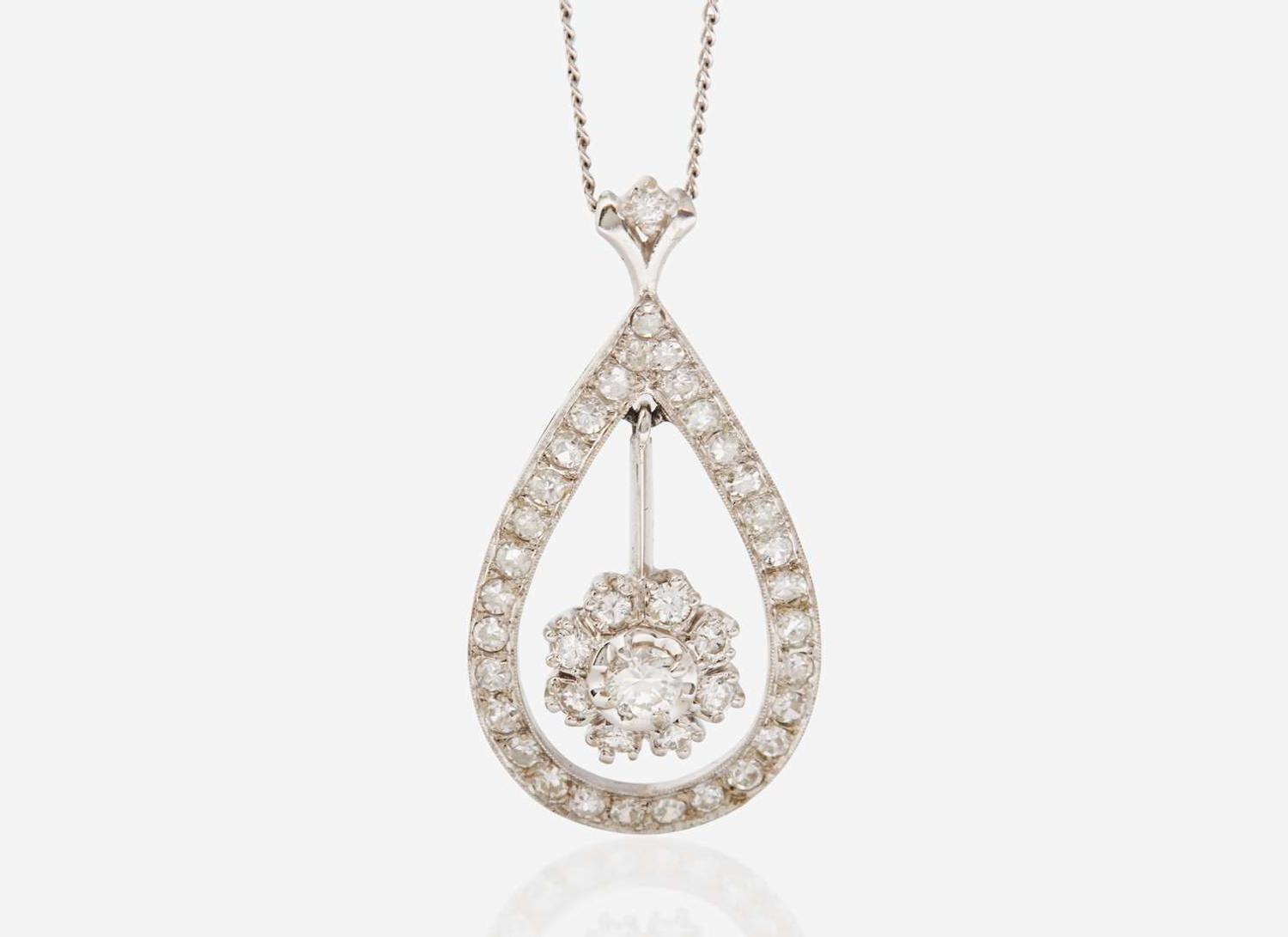 A Set of 14K White Gold and Diamond Earrings and Necklace