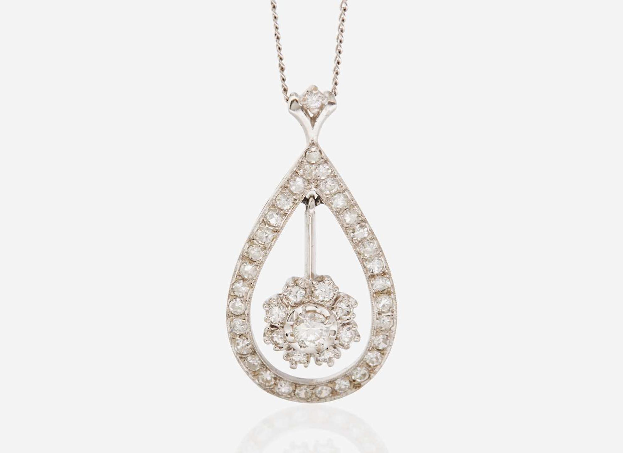 A Set of 14K White Gold and Diamond Earrings and Necklace