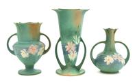 Three Roseville Cosmos Pottery Vases Height of tallest 10 1/4 inches.