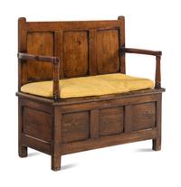 An English Carved Oak Settle