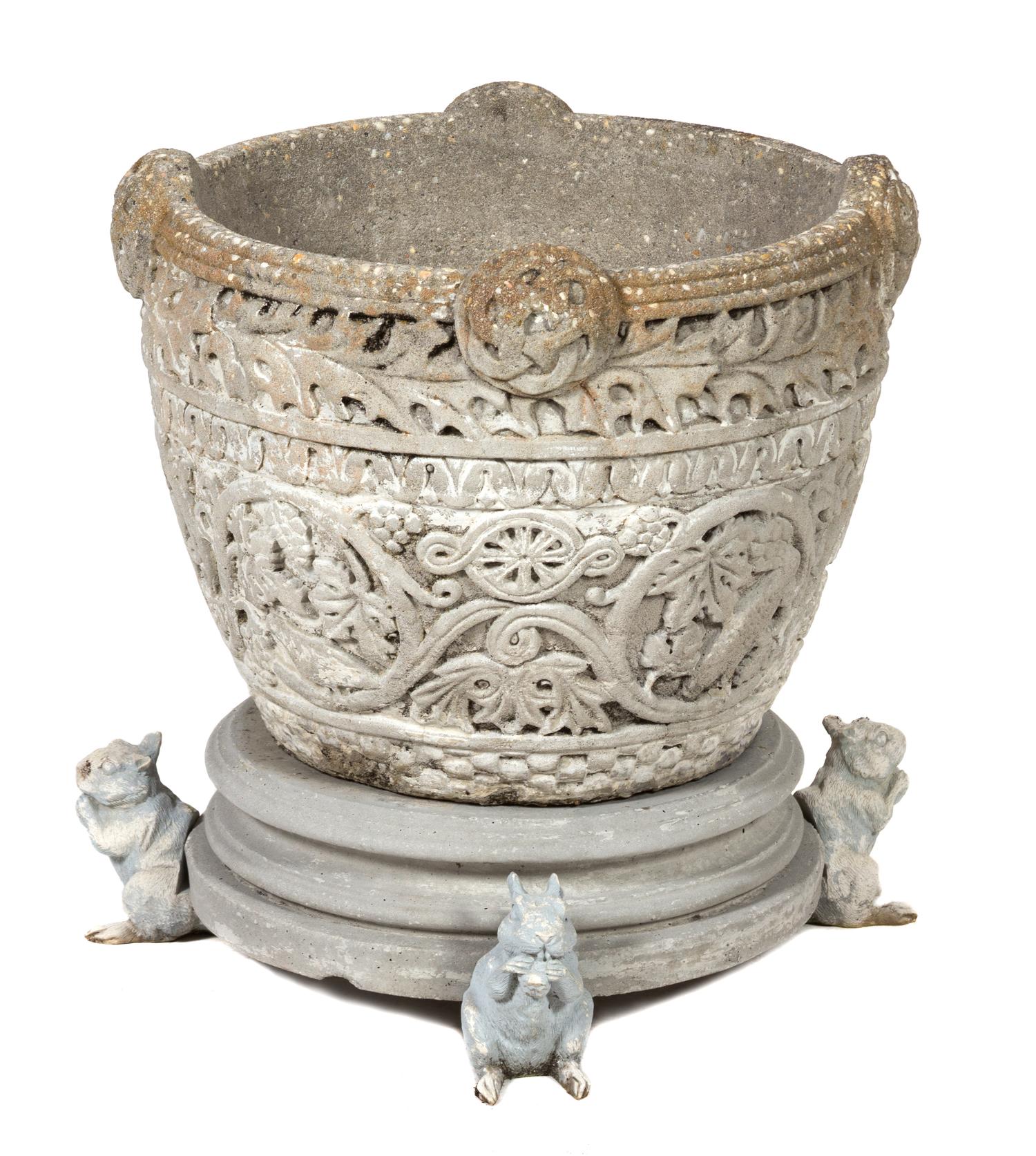 A Poured Cement Garden Pot Height 15 1/2 x diameter 20 inches.