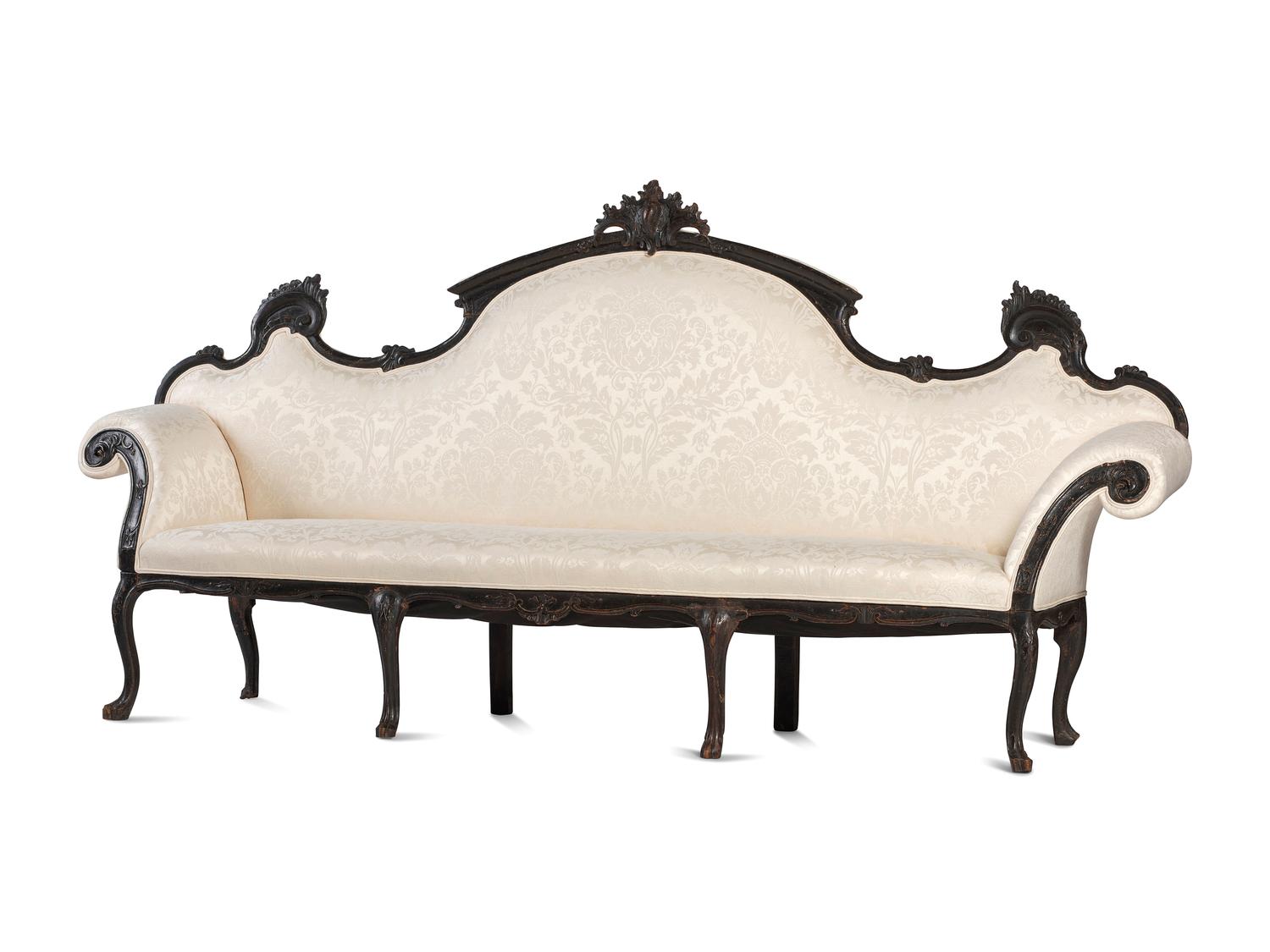 An Italian Carved and Black Painted Walnut High-Back Sofa