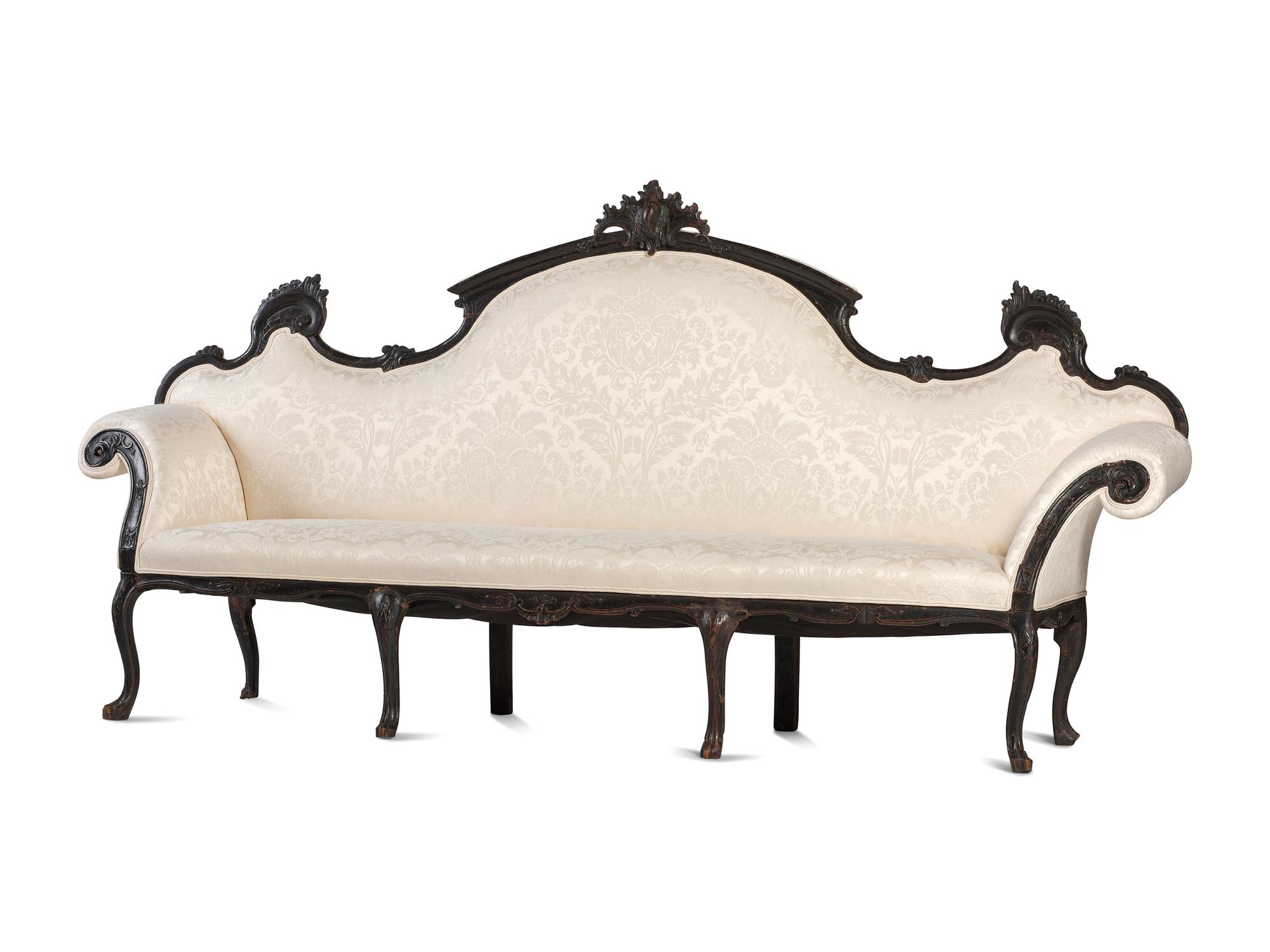An Italian Carved and Black Painted Walnut High-Back Sofa
