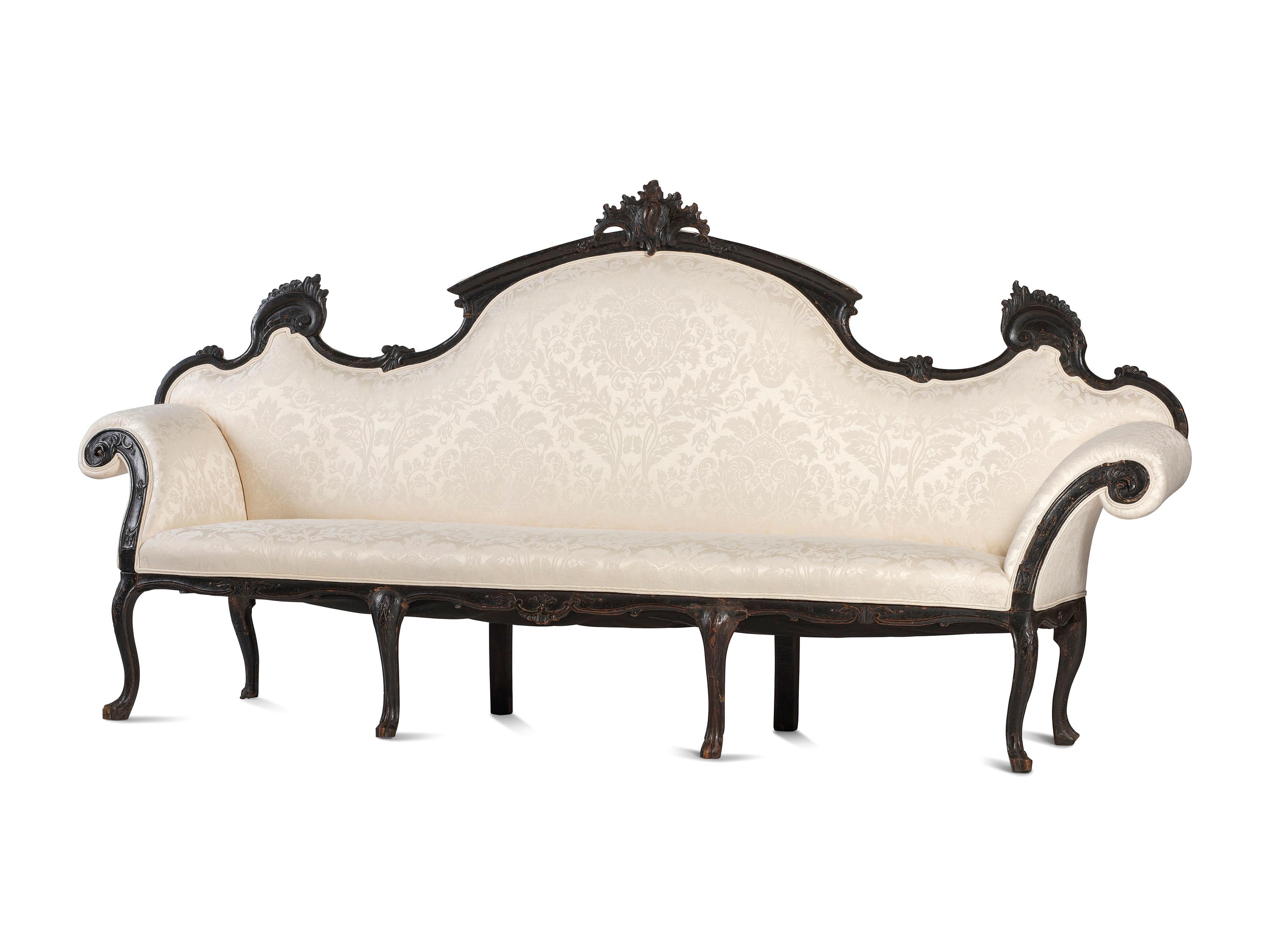An Italian Carved and Black Painted Walnut High-Back Sofa
