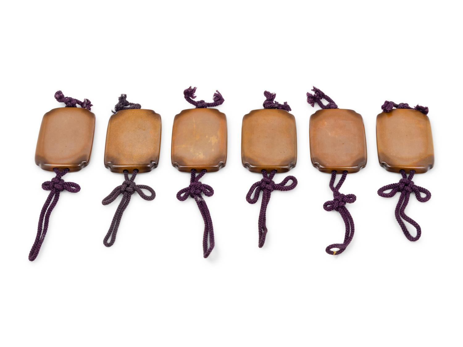 A Set of Six Yellow Bronze Screen Weights