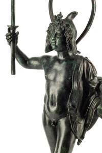 A Continental Patinated Bronze Figure with a Rock Crystal Ornament