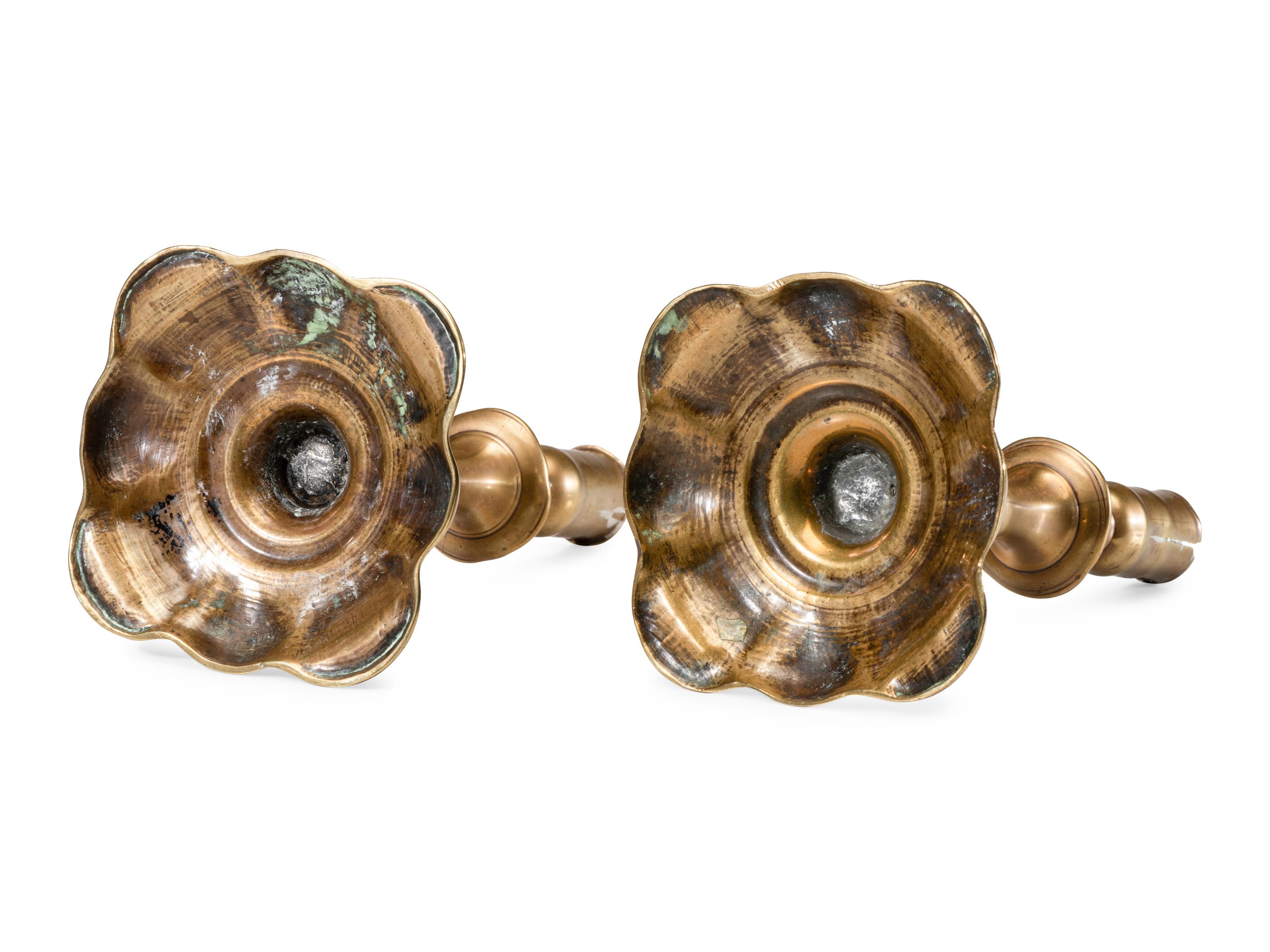 A Pair of English Brass Scalloped-Foot Candlesticks