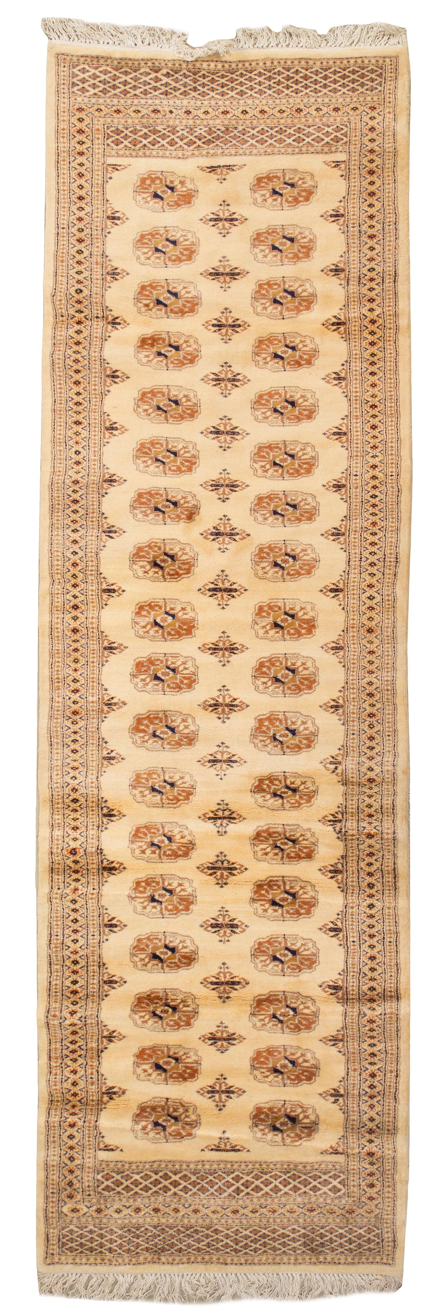 A Bokhara Wool Runner, 10 feet 5 inches x 3 feet 2 inches.