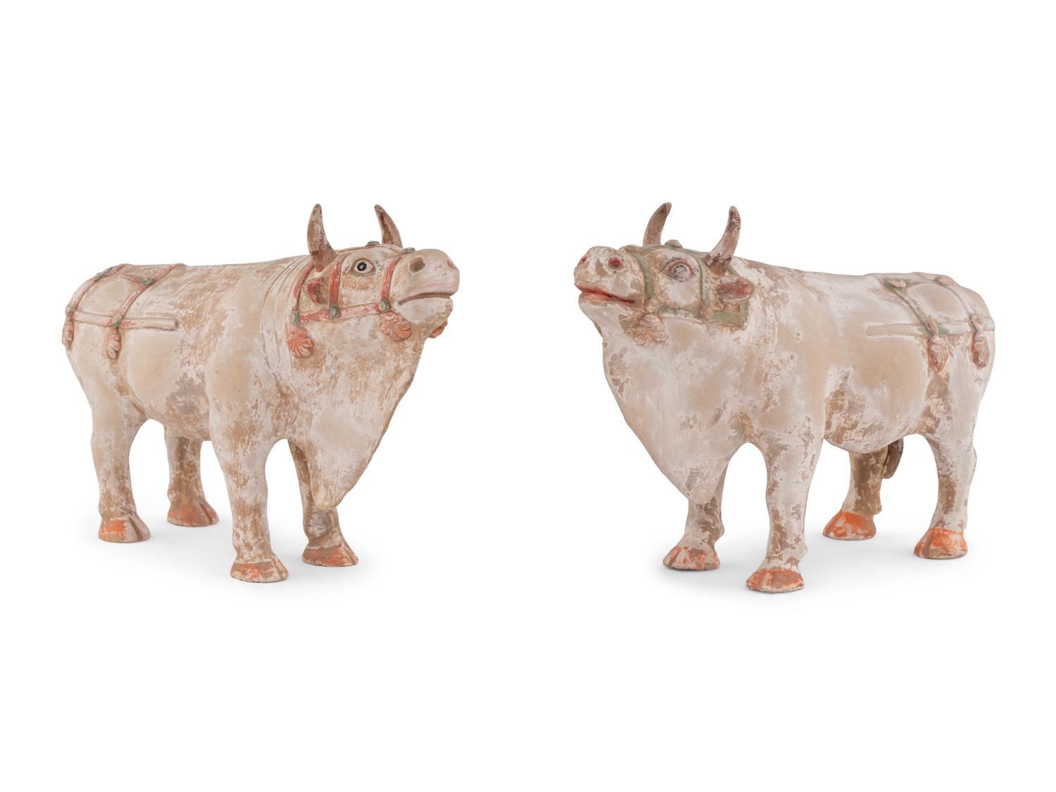 A Pair of Chinese Painted Pottery Figures of Oxen