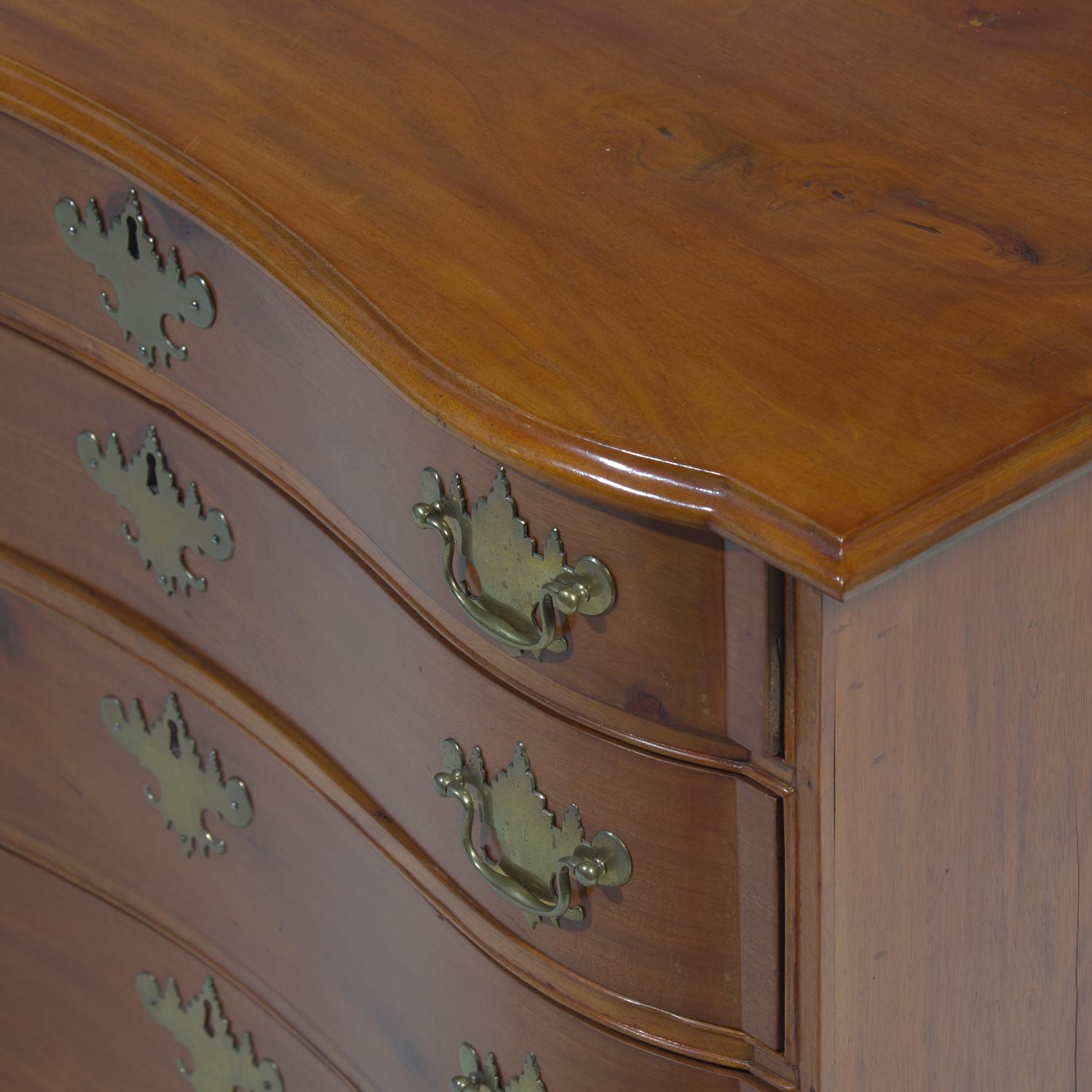 A Chippendale Cherry Oxbow Chest of Drawers