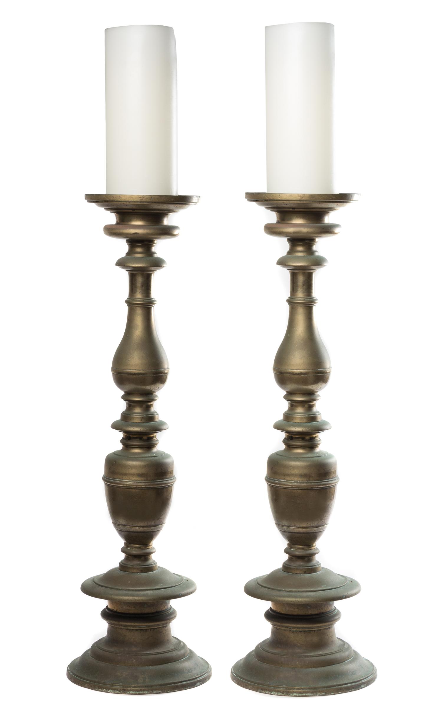 A Pair of Baroque Style Brass Prickets Height 33 1/2 inches.