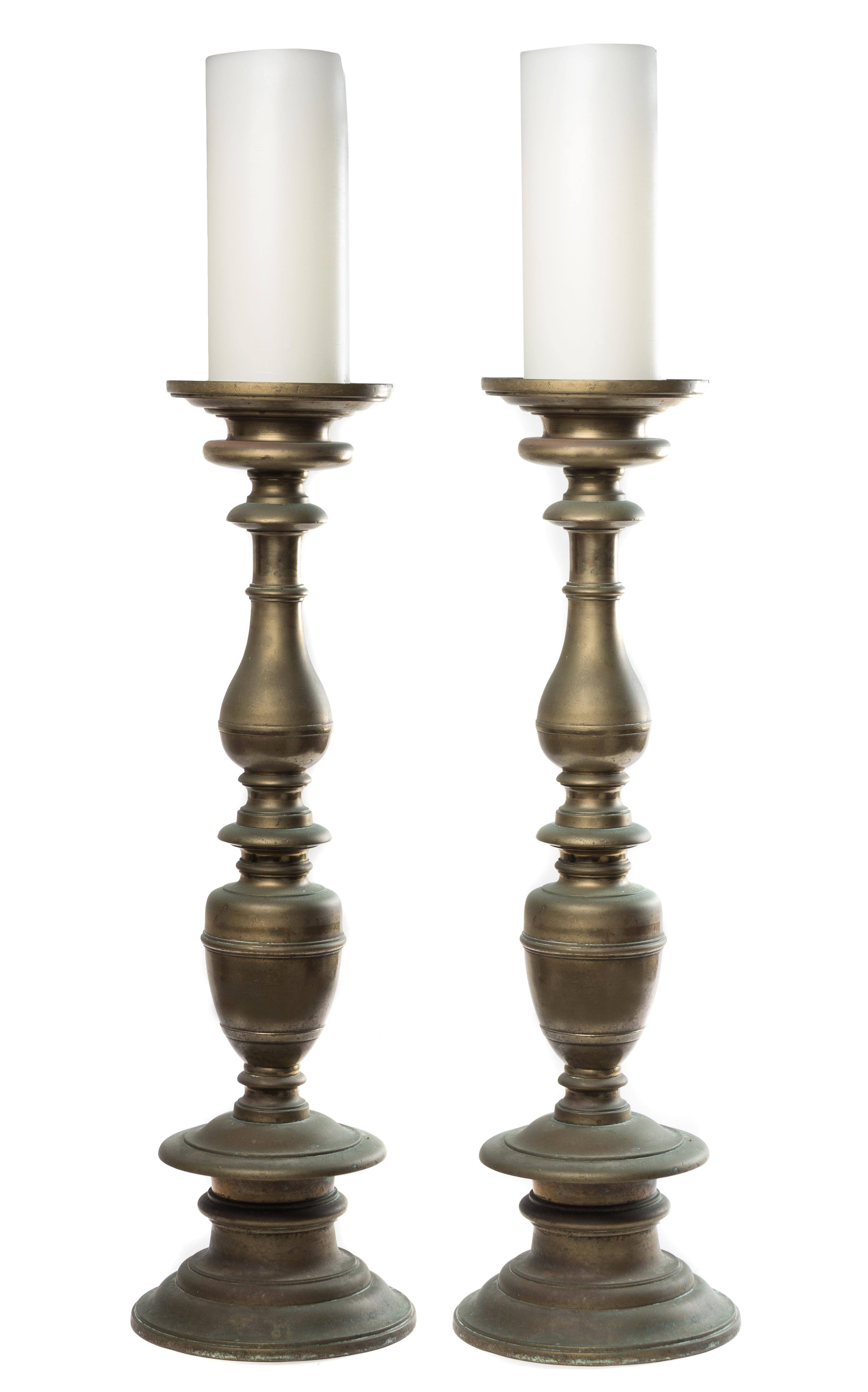 A Pair of Baroque Style Brass Prickets Height 33 1/2 inches.