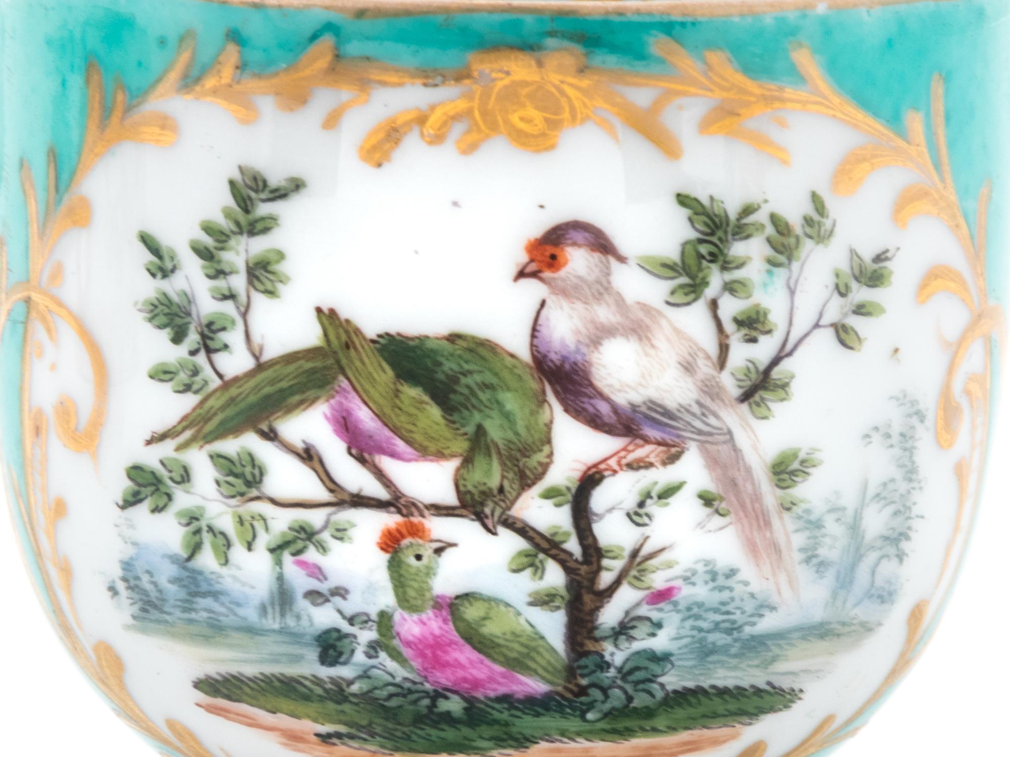 Three Meissen Painted and Parcel Gilt Porcelain Cup and Saucer Sets, a Covered Cup and Two Spoons