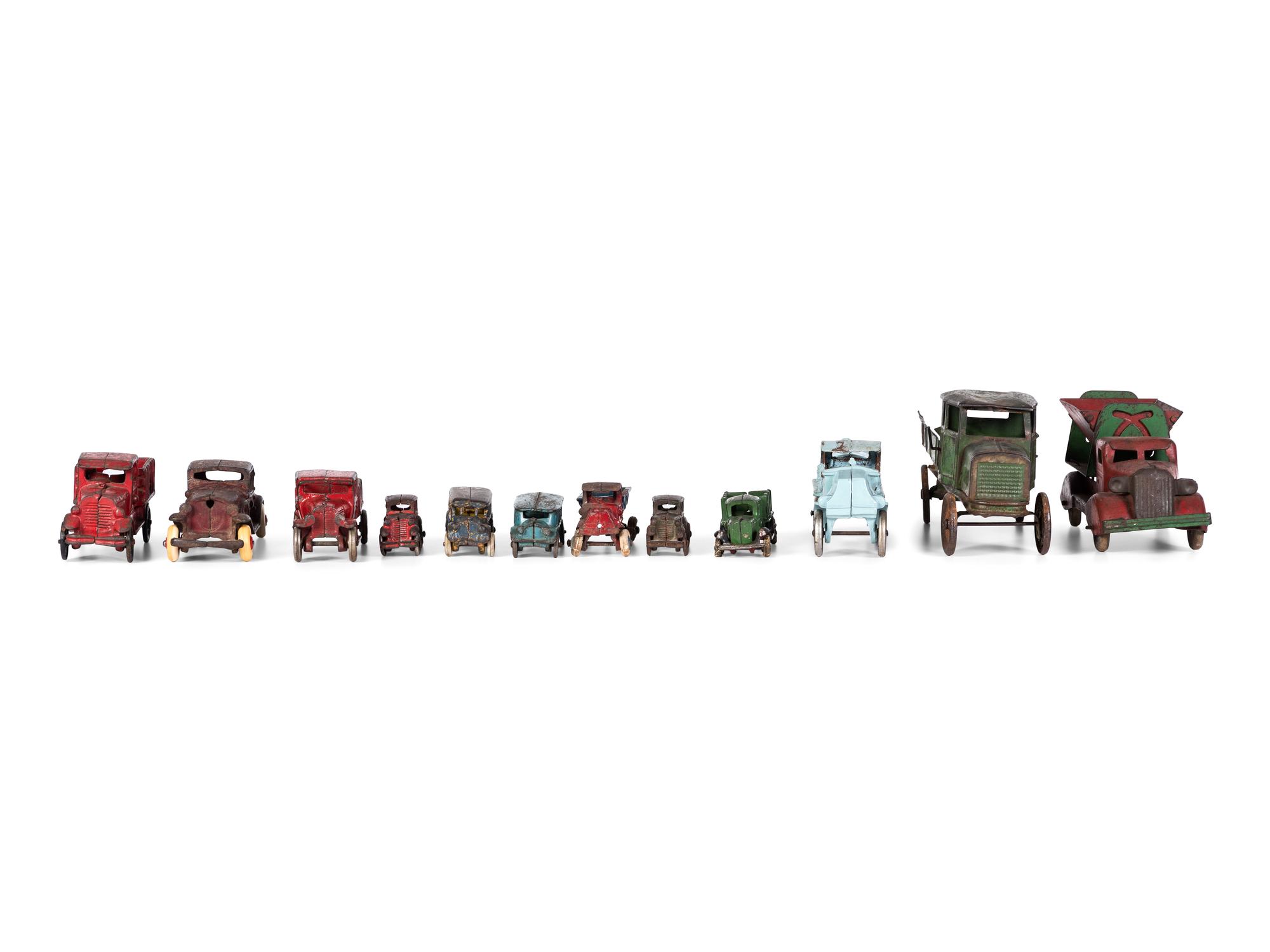 Twelve Painted Cast Iron Cars, Buses, and Trucks
