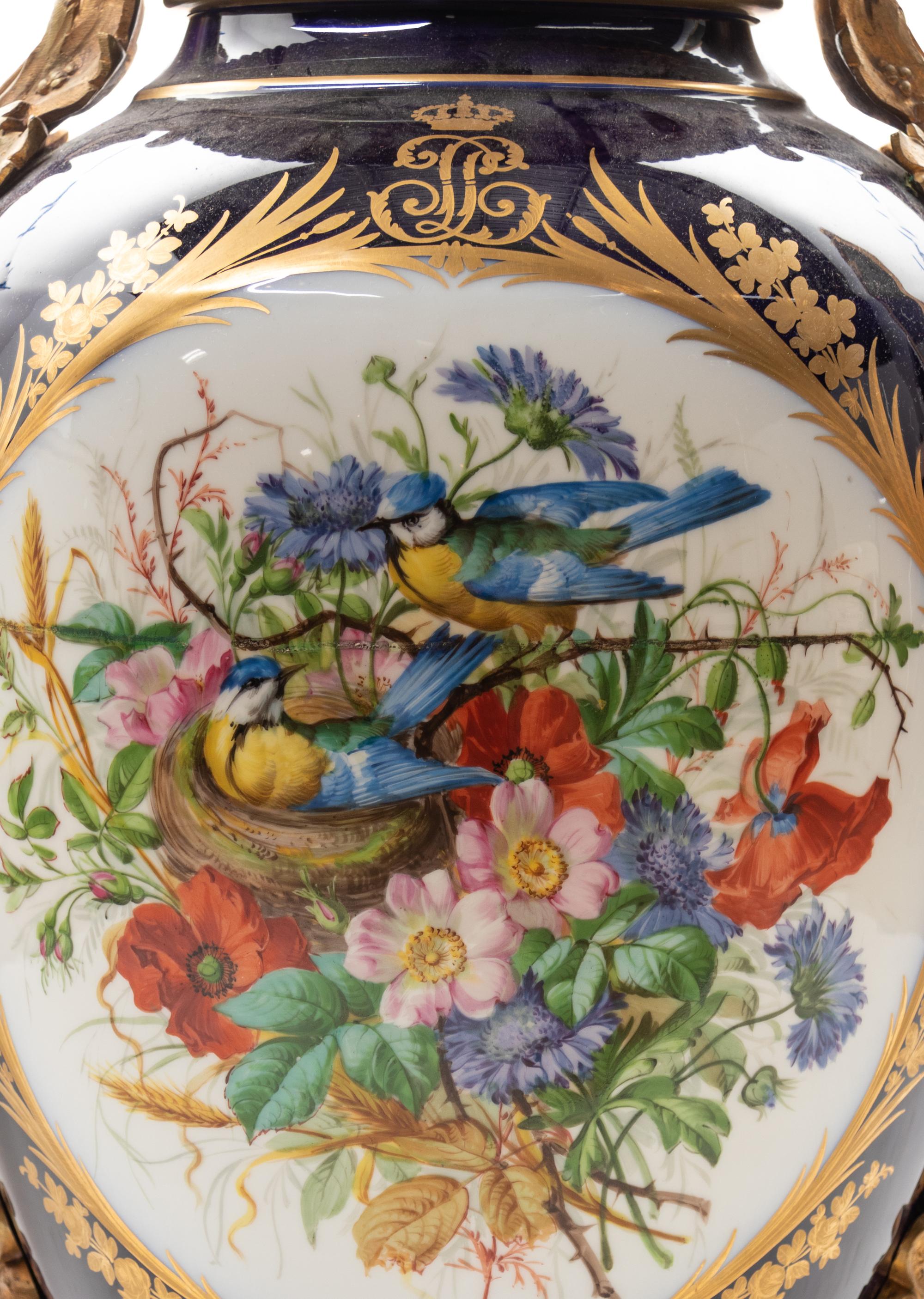 A Sèvres Style Gilt Bronze Mounted Painted and Parcel Gilt Porcelain Urn