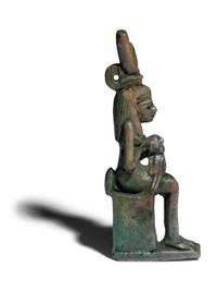 An Egyptian Faience Isis Nursing Horus Amulet