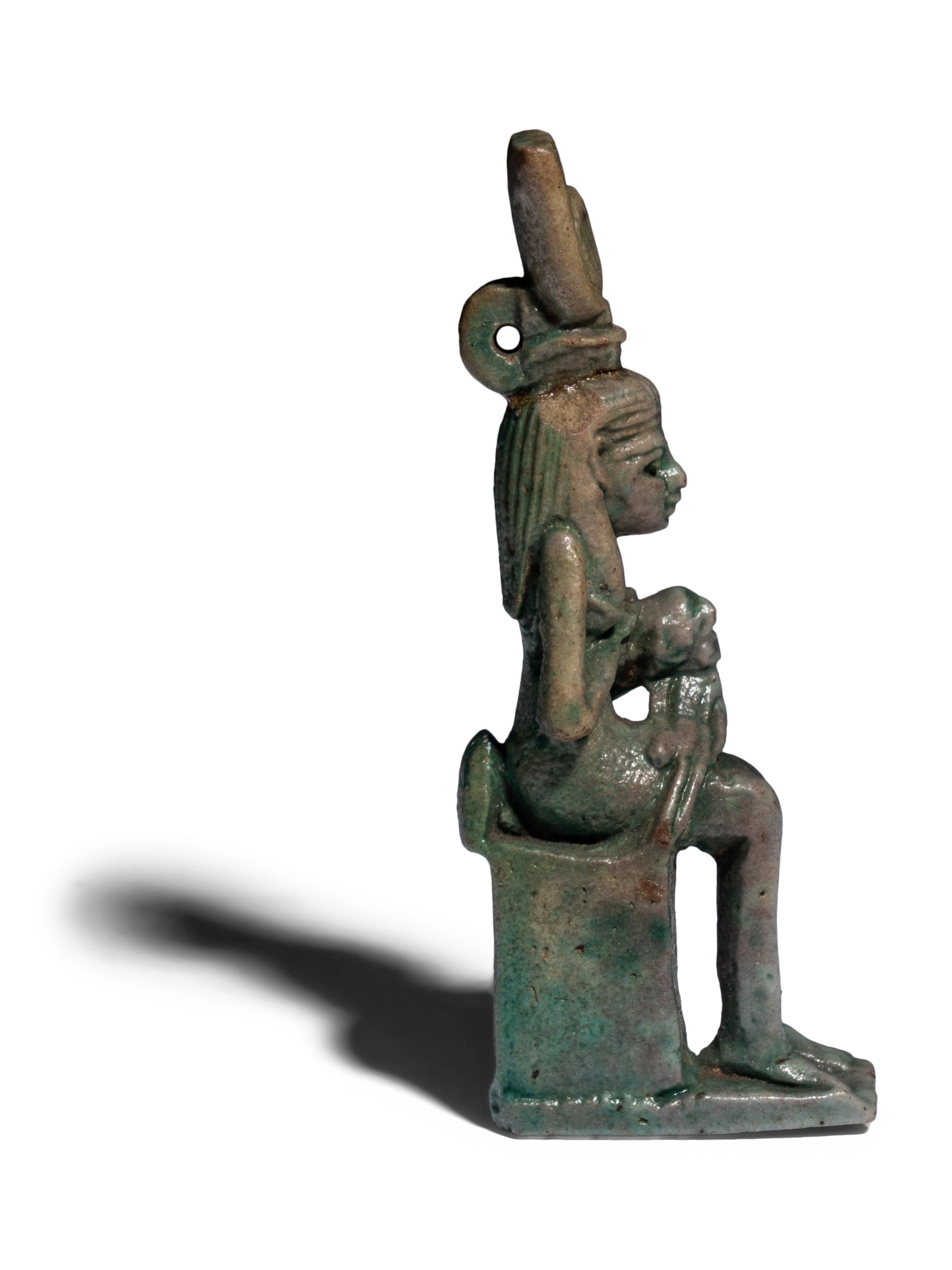 An Egyptian Faience Isis Nursing Horus Amulet
