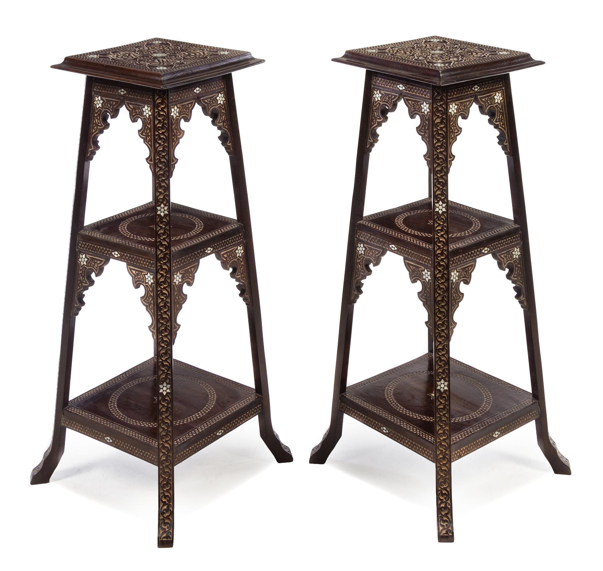A Pair of Middle Eastern Ebonized and Mother-of-Pearl Inlaid Pedestal Tables Height 40 inches. — 20TH CENTURY
