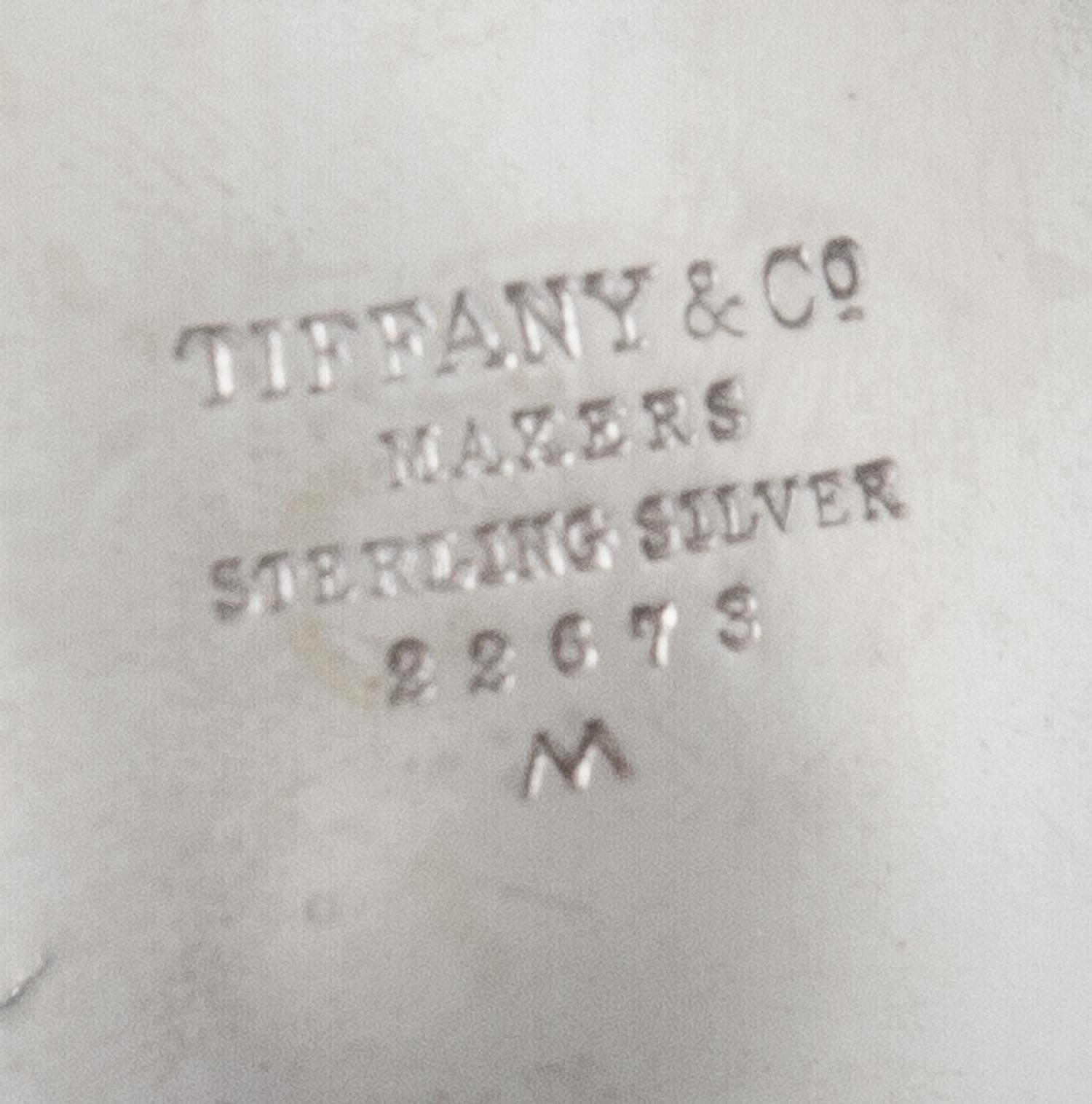 An American Silver Small Bowl, Tiffany & Co., New York, NY, 1940, circular with scalloped sides, raised on three ball feet, engraved in