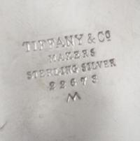 An American Silver Small Bowl, Tiffany & Co., New York, NY, 1940, circular with scalloped sides, raised on three ball feet, engraved in
