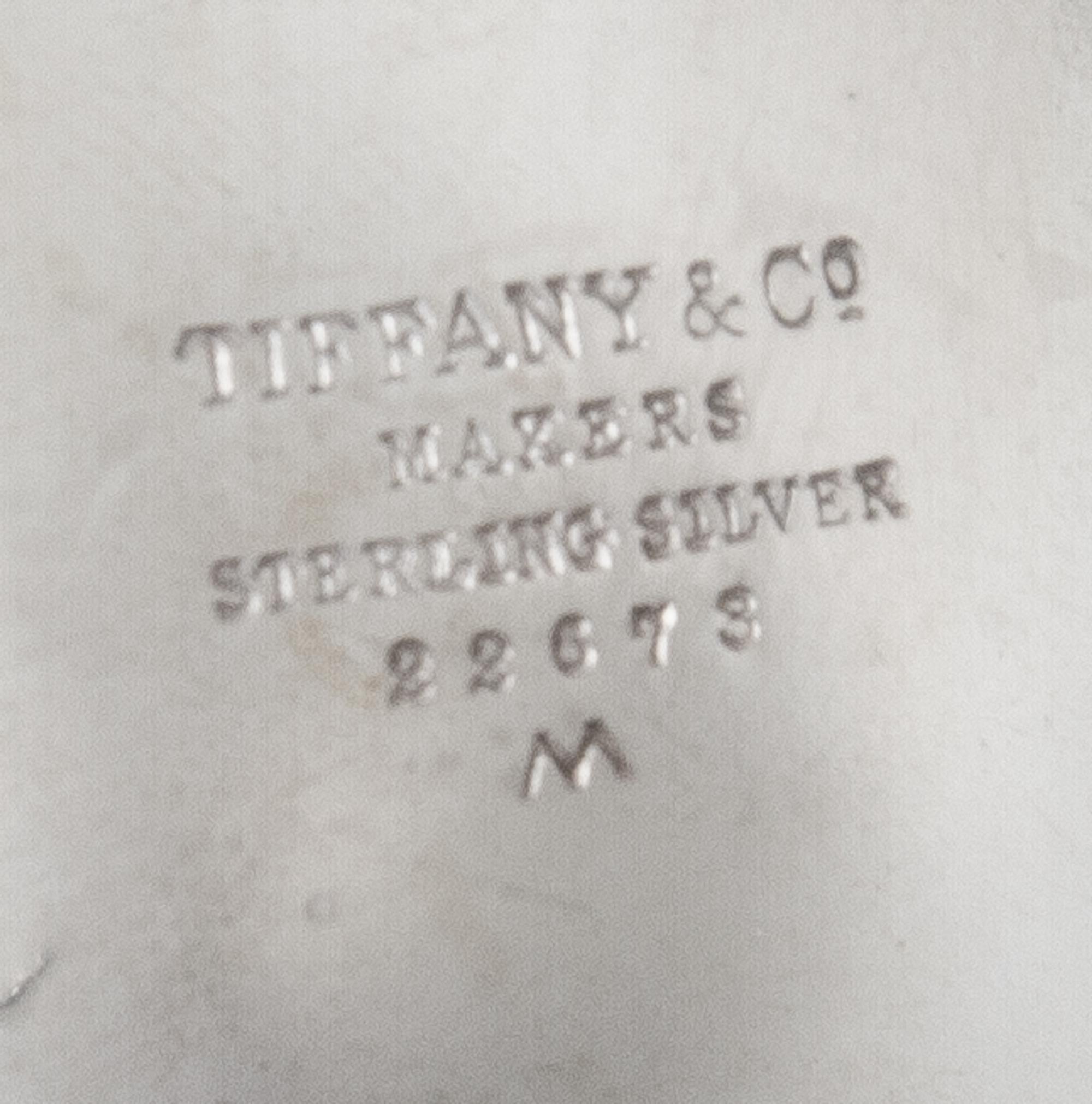 An American Silver Small Bowl, Tiffany & Co., New York, NY, 1940, circular with scalloped sides, raised on three ball feet, engraved in