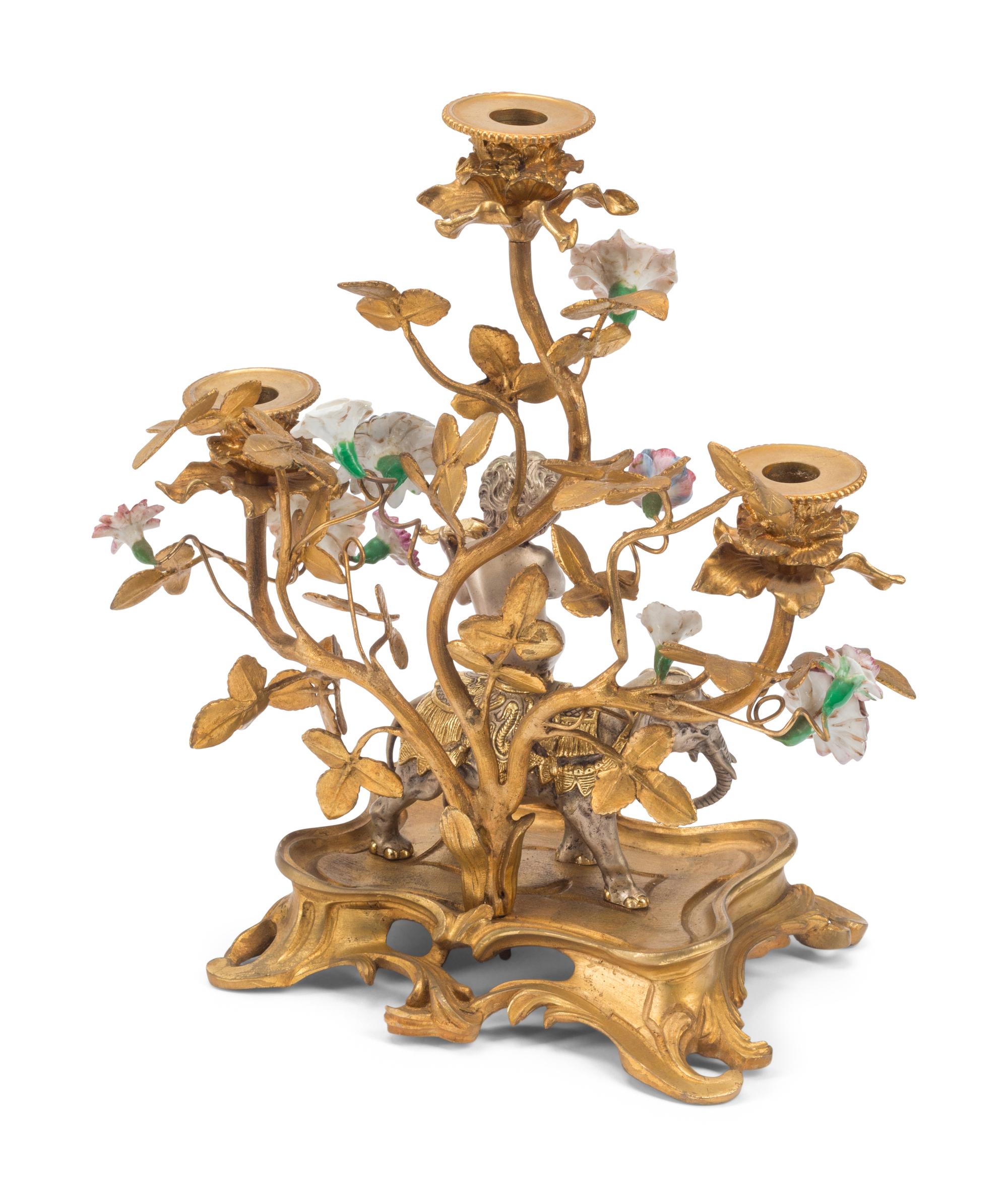 A Pair of Louis XV Style Gilt Bronze, Silvered Bronze and Porcelain Candelabra