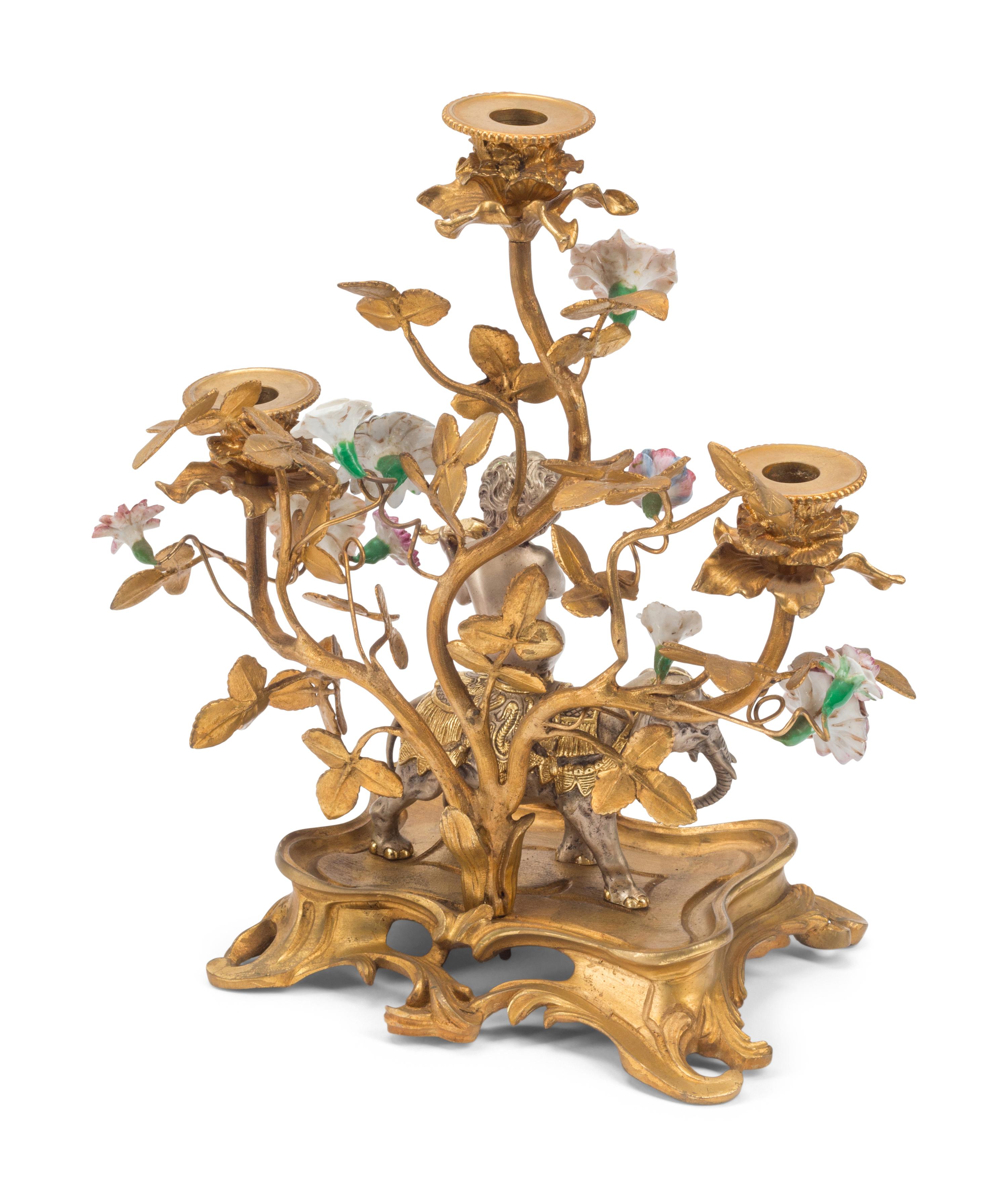 A Pair of Louis XV Style Gilt Bronze, Silvered Bronze and Porcelain Candelabra
