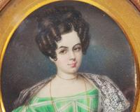 Spanish School 19th Century, A Portrait Miniature of A Young Lady in Green Checked Dress
