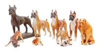 A Group of Eight Boxer Figurines Height of tallest 9 3/4 inches.