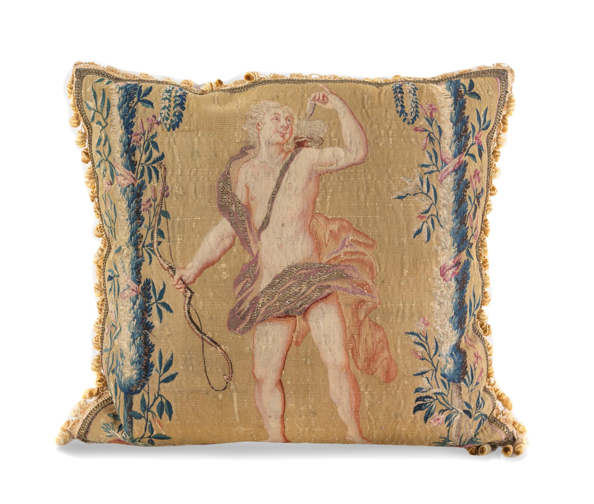 A Continental Tapestry Pillow and Three Modern Pillows