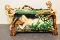 A Figural Jardiniere. Height 8 1/4 x length 13 x width 7 inches.