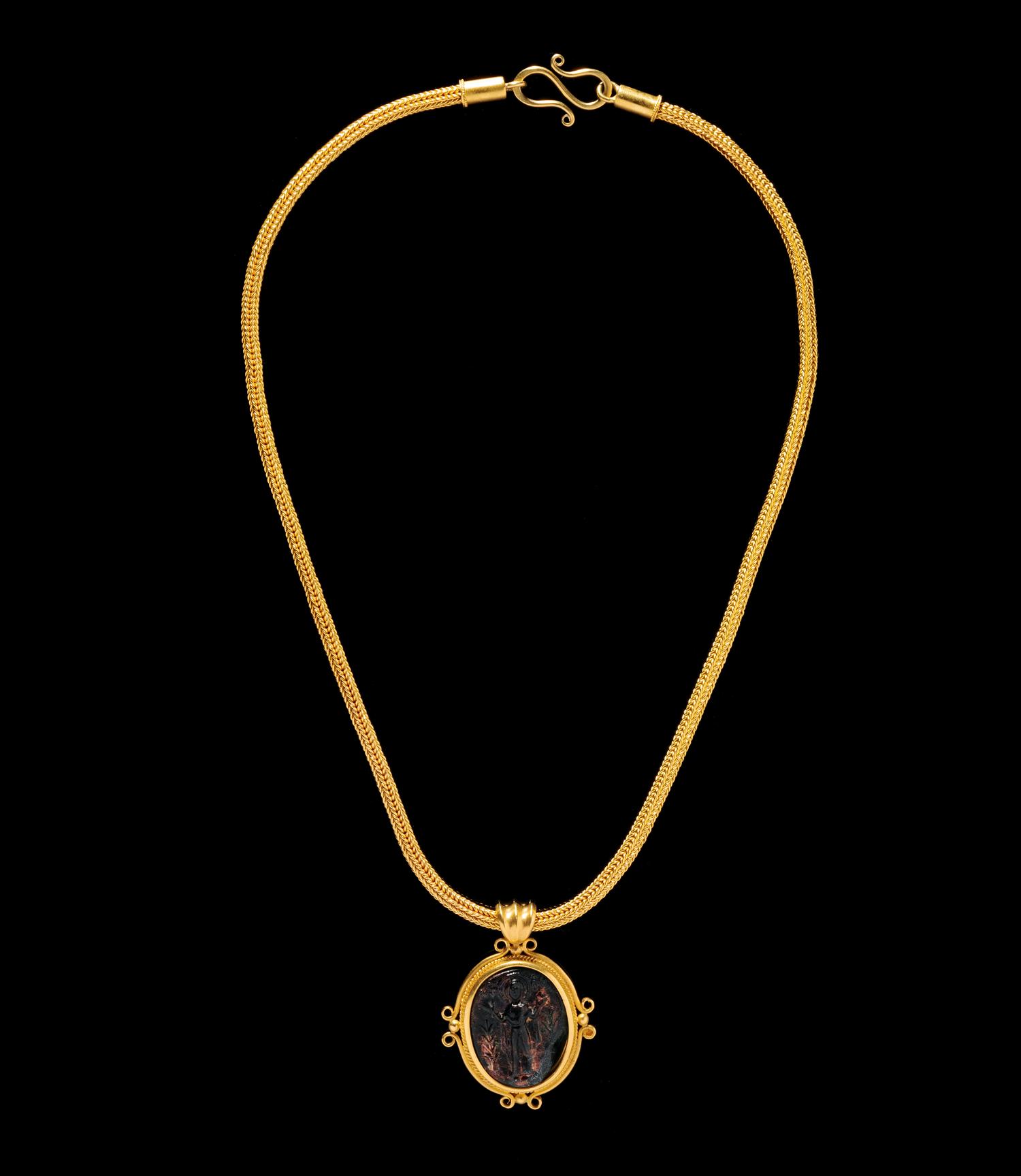 A Byzantine Gold Necklace with Molded Green Glass Cameo