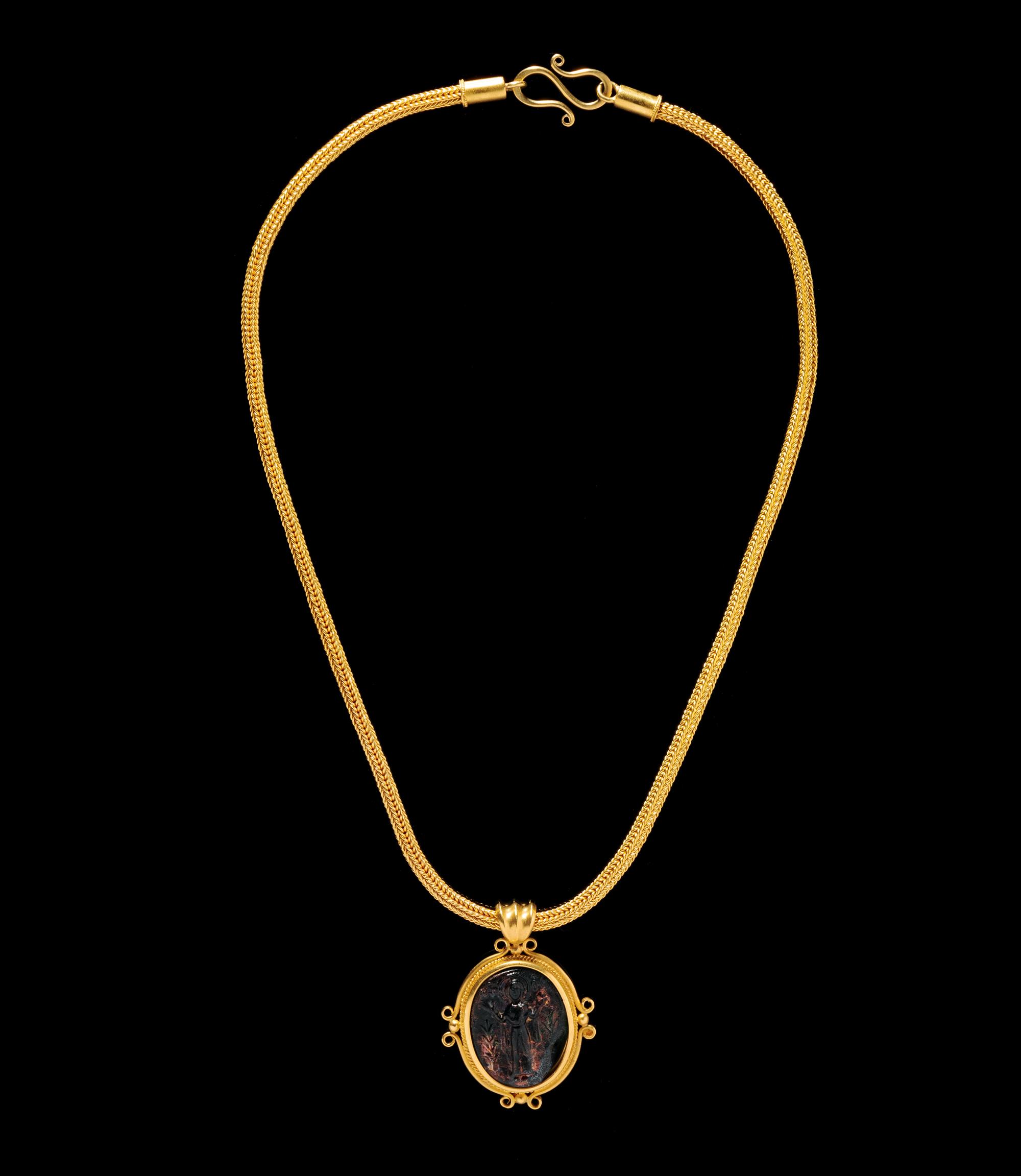 A Byzantine Gold Necklace with Molded Green Glass Cameo