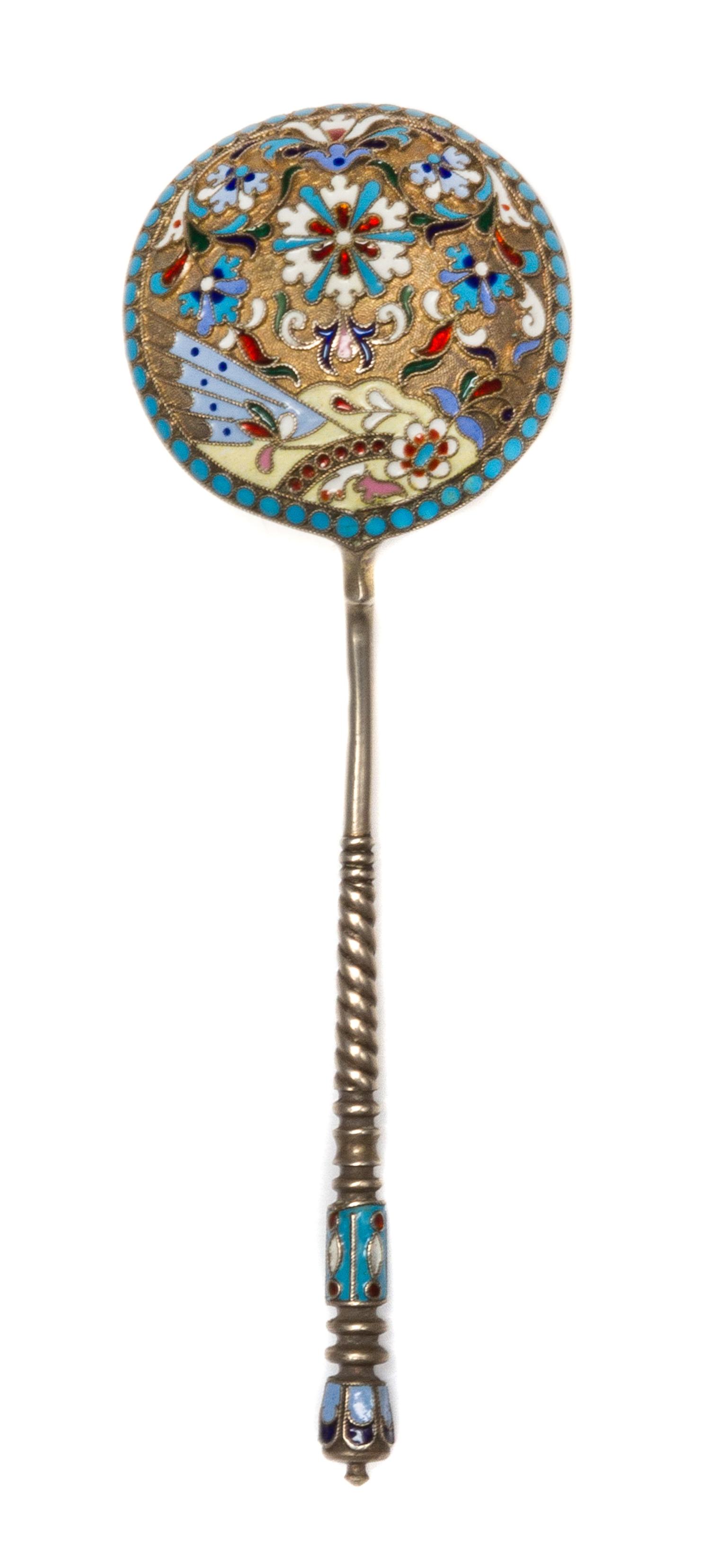 A Russian Enameled Silver Spoon, Maker's mark obscured, Moscow, the back of the circular bowl worked with flower heads against a textur