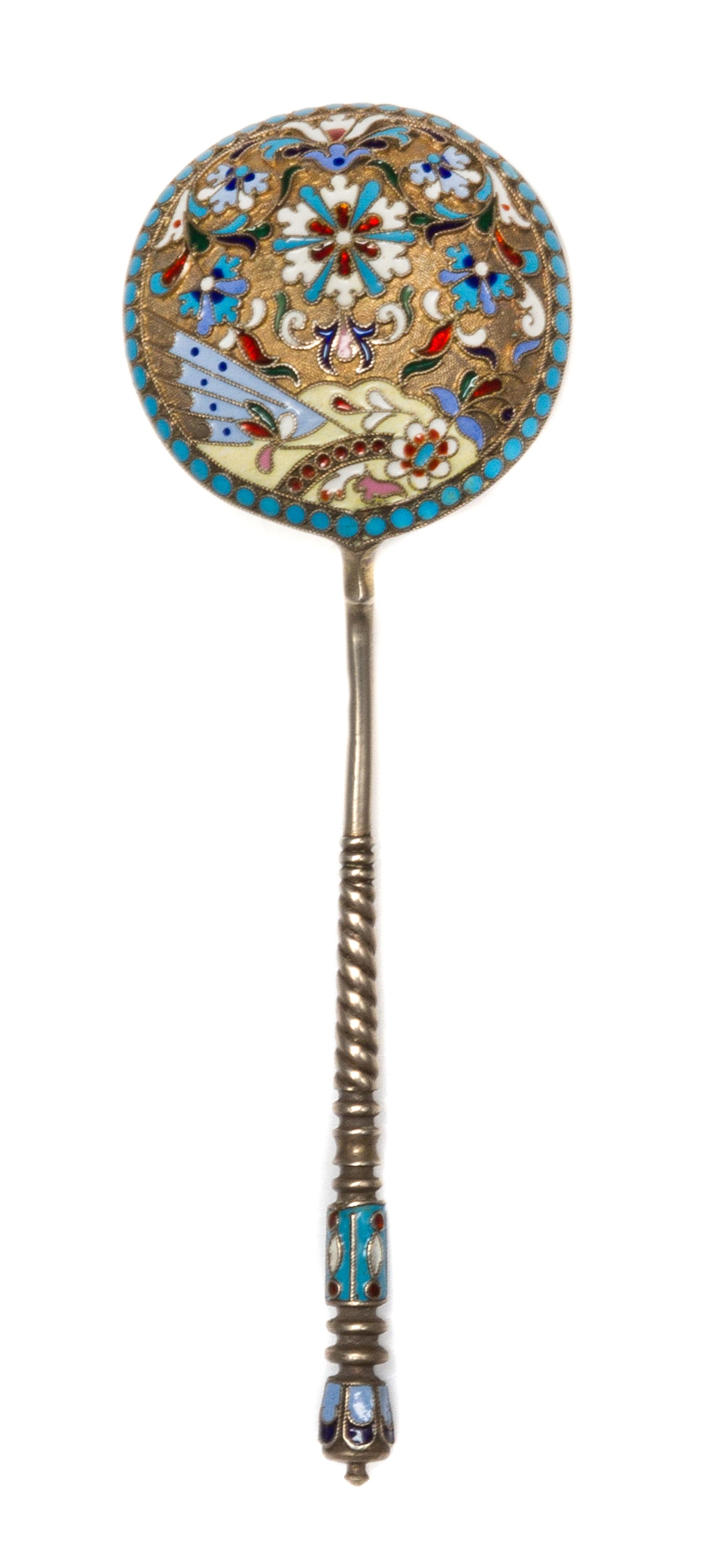 A Russian Enameled Silver Spoon, Maker's mark obscured, Moscow, the back of the circular bowl worked with flower heads against a textur