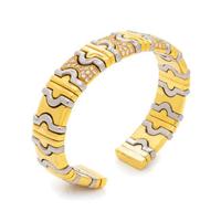 DINO CEVA, YELLOW GOLD, STEEL AND DIAMOND CUFF BRACELET