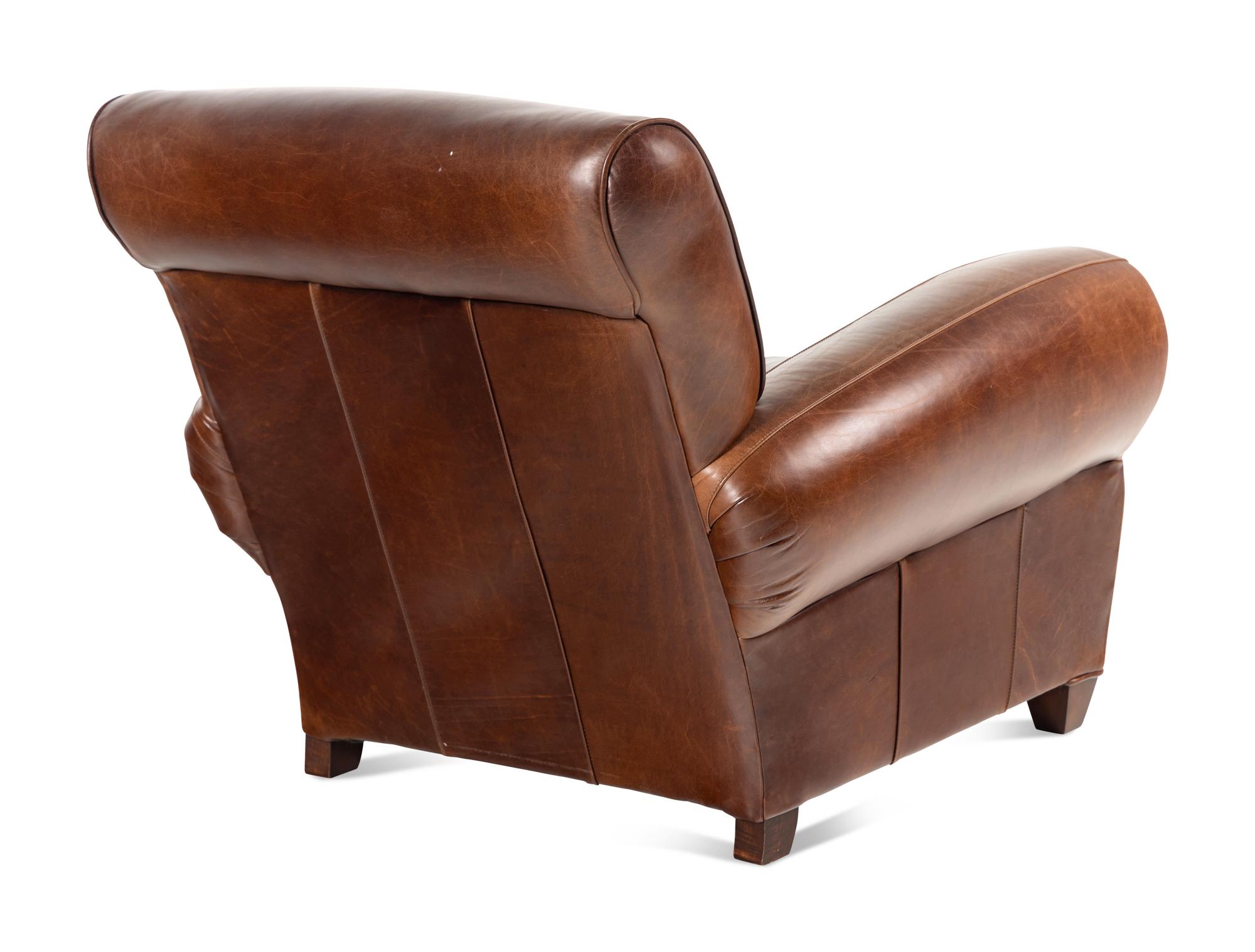 A Contemporary Leather-Upholstered Lounge Chair and Ottoman