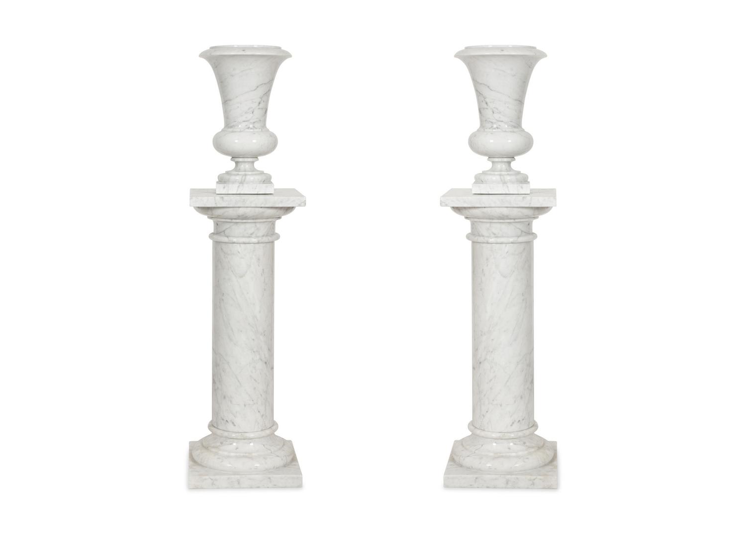 A Pair of White Marble Urns on Matching Pedestals