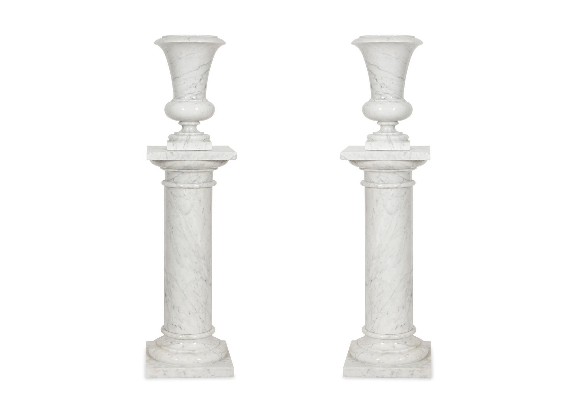 A Pair of White Marble Urns on Matching Pedestals