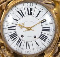 A Louis XV Style Gilt Bronze Cartel Clock by Henry Dasson