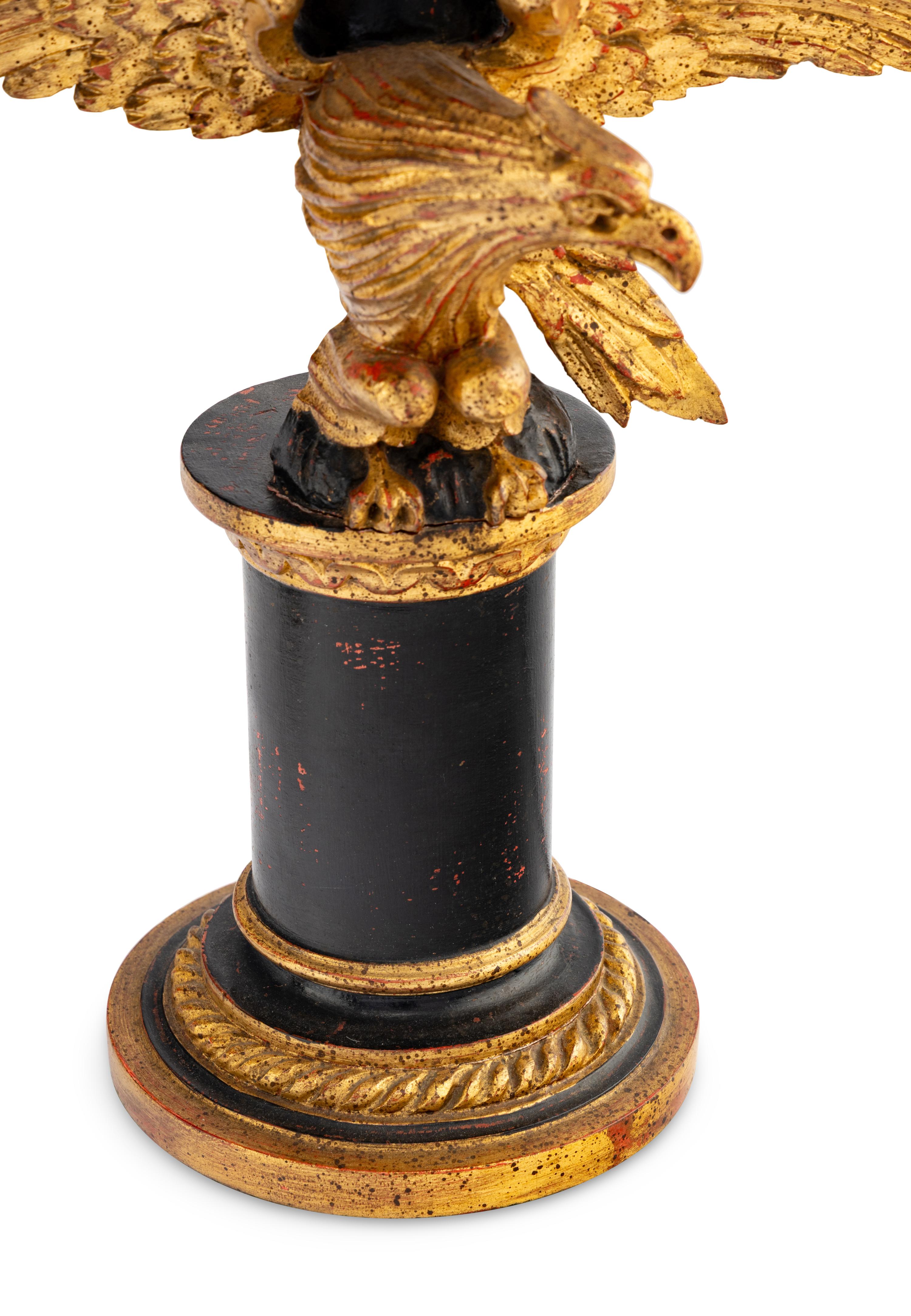 A Pair of Painted and Parcel Gilt Eagle-Form Lamps