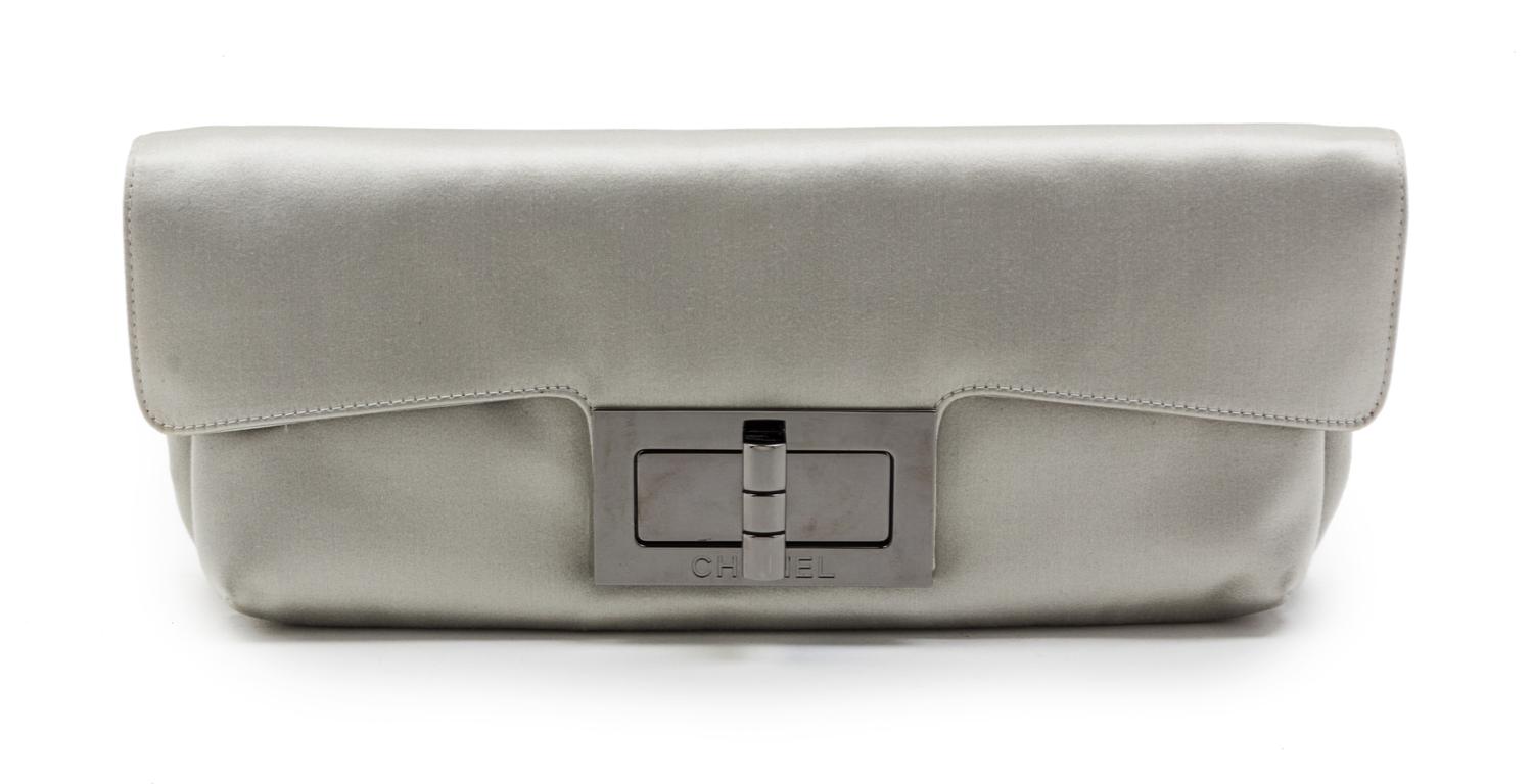 A Chanel Light Grey Satin Clutch, 12 1/2 x 5 x 2 1/2 inches.