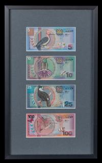 A Framed Group of Four Suriname Series 2000 Bank Notes