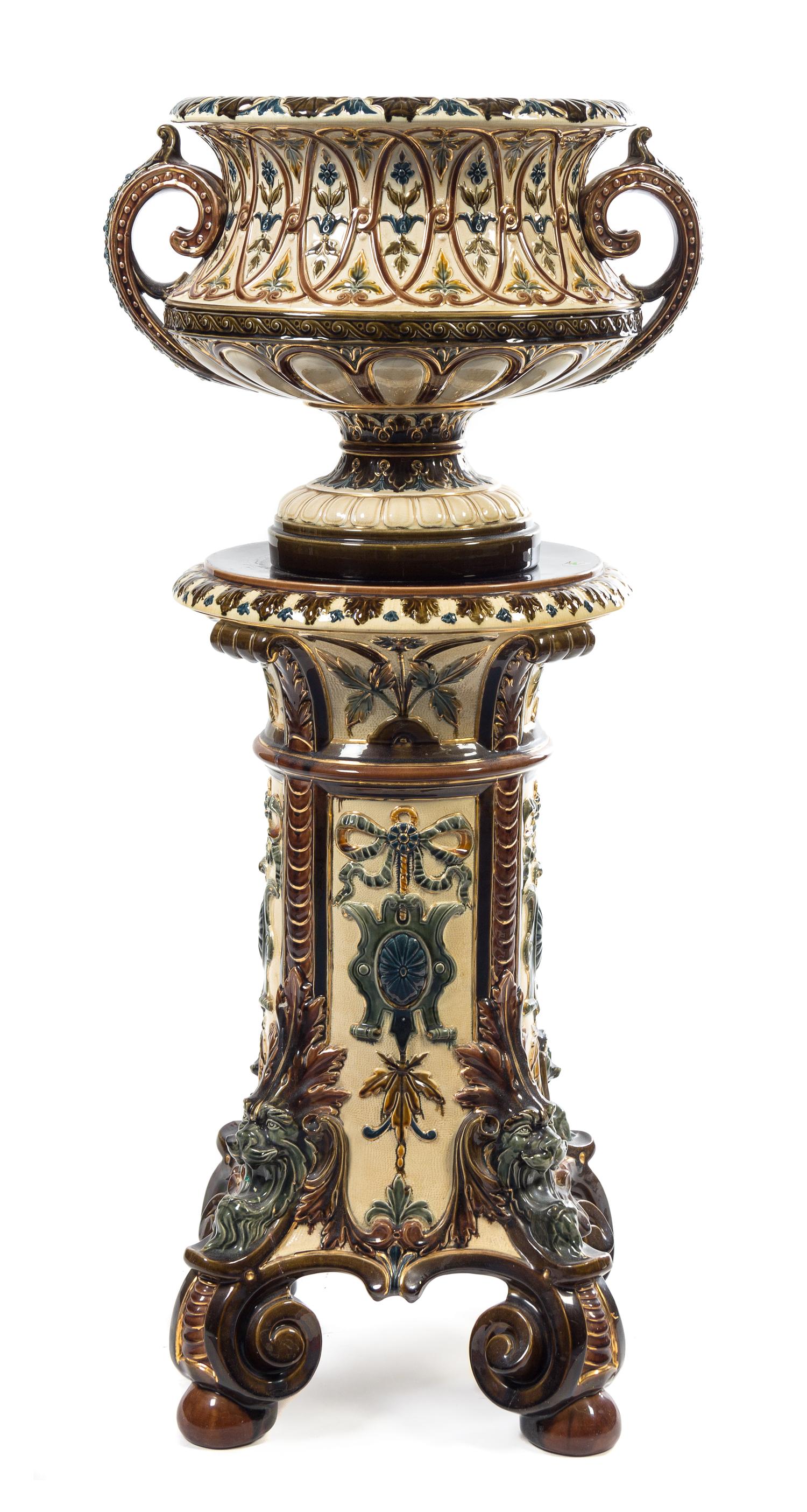 A Continental Majolica Urn and Pedestal Height overall 46 1/2 inches.